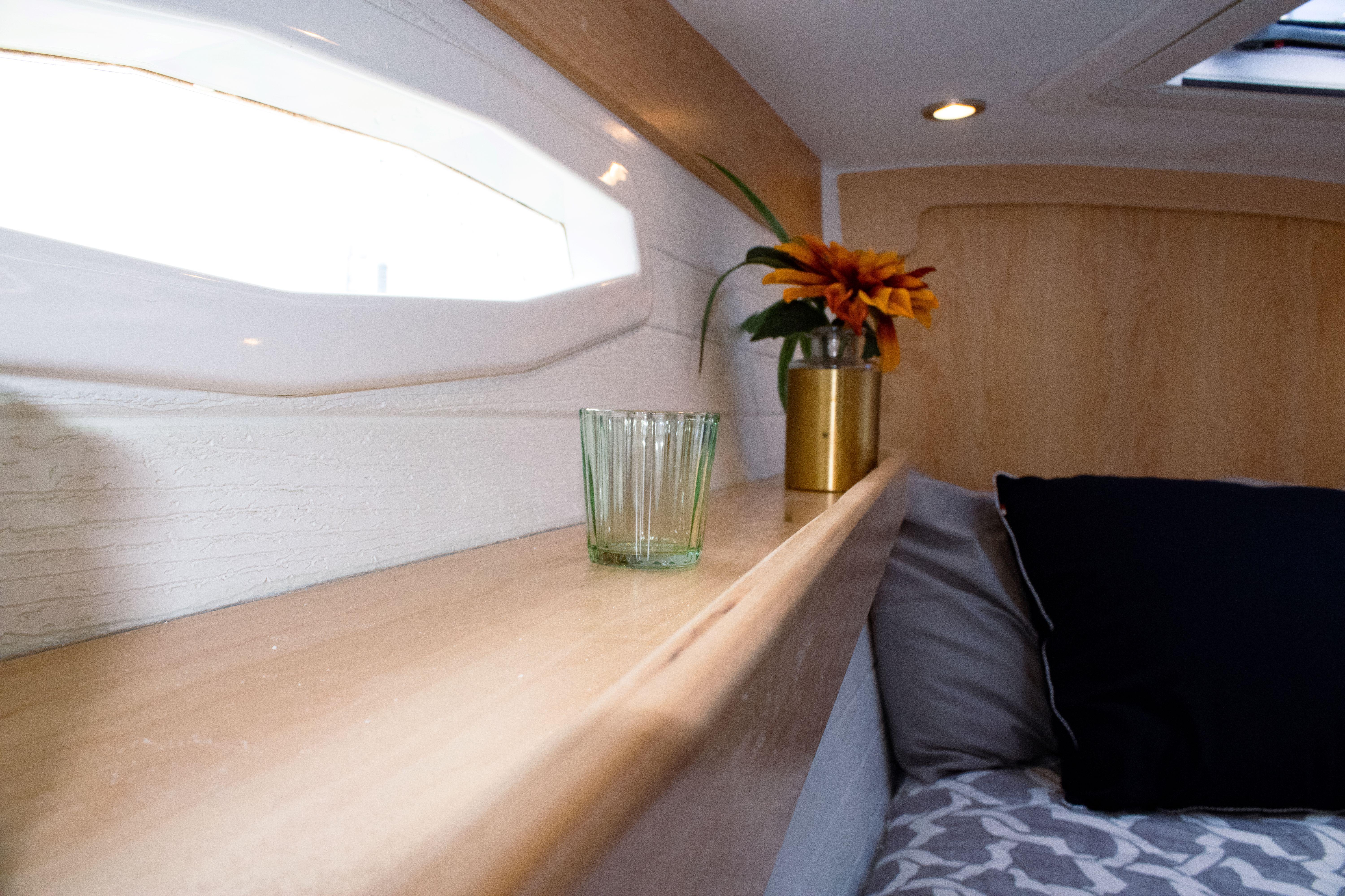 Tartan-365 2023-SEA #5 IN STOCK WA-US-Cozy interior of 2023 Tartan 365 yacht with flower vase and glass.-9568831 | Thumbnail
