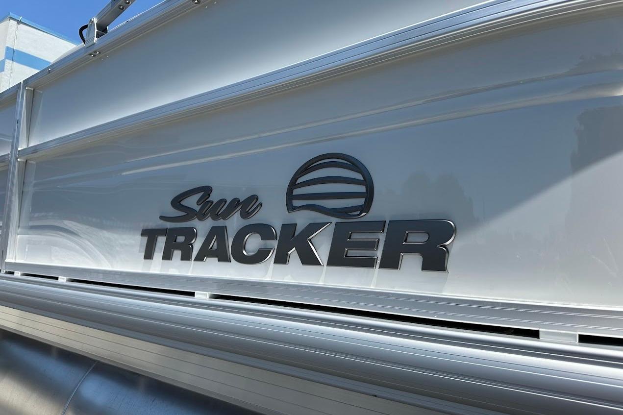 2026 Sun Tracker Party Barge 20 DLX logo on boat exterior.