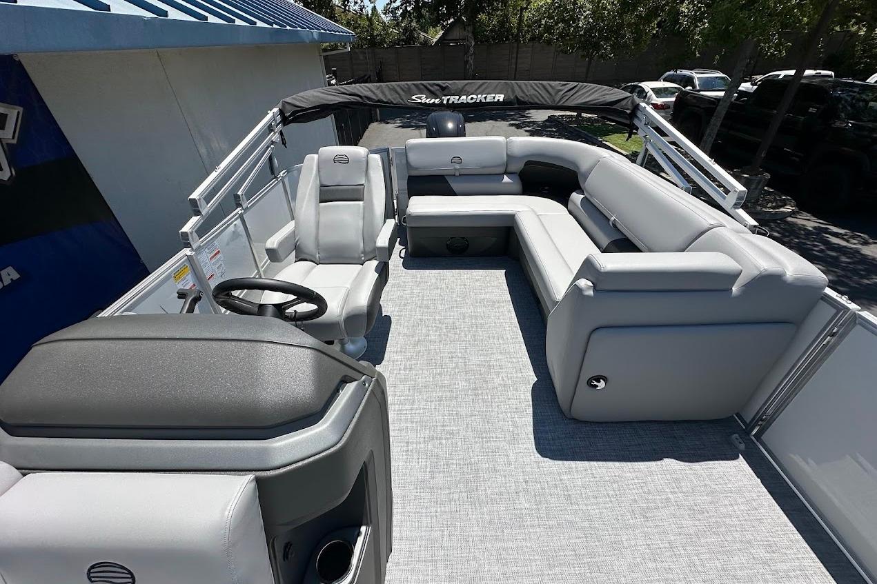 2026 Sun Tracker Party Barge 20 DLX pontoon boat with spacious seating and modern design.