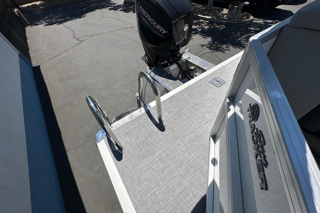 2026 Sun Tracker Party Barge 20 DLX with Mercury outboard motor and swim ladder.