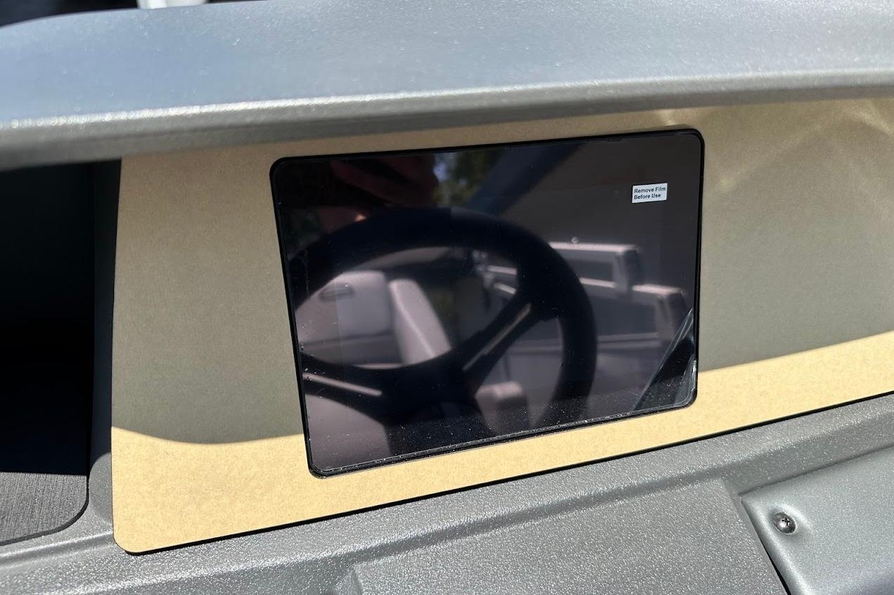 Dashboard of 2026 Sun Tracker Party Barge 20 DLX with protective film on display.