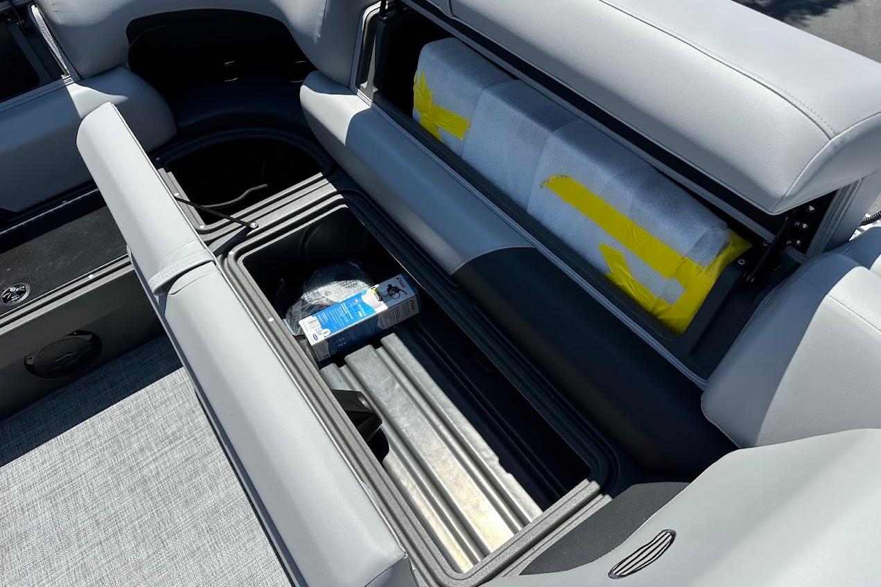 Interior storage of 2026 Sun Tracker Party Barge 20 DLX with open compartments.