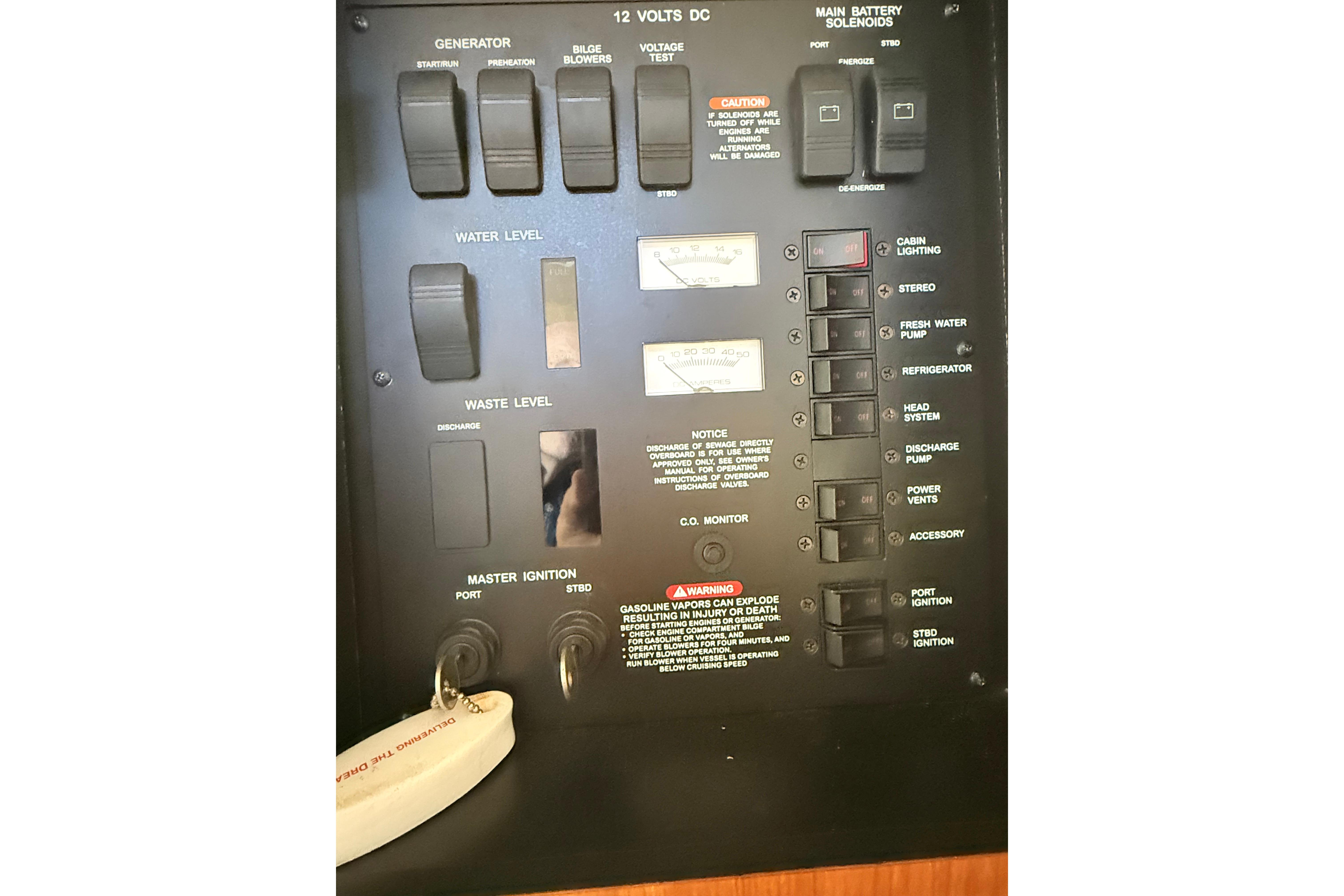 Control panel of a 2001 Sea Ray 340 Sundancer boat, showing various switches and indicators.