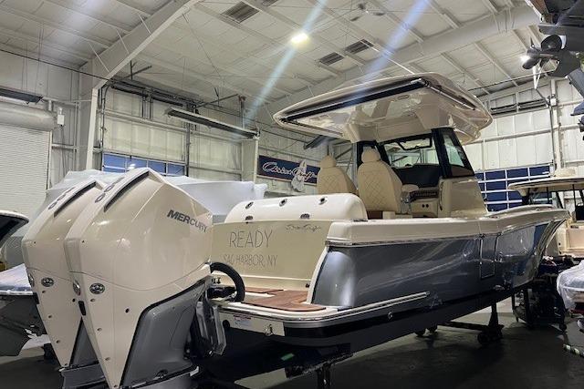 2023 Chris-Craft Catalina 30 boat in showroom with Mercury engines.