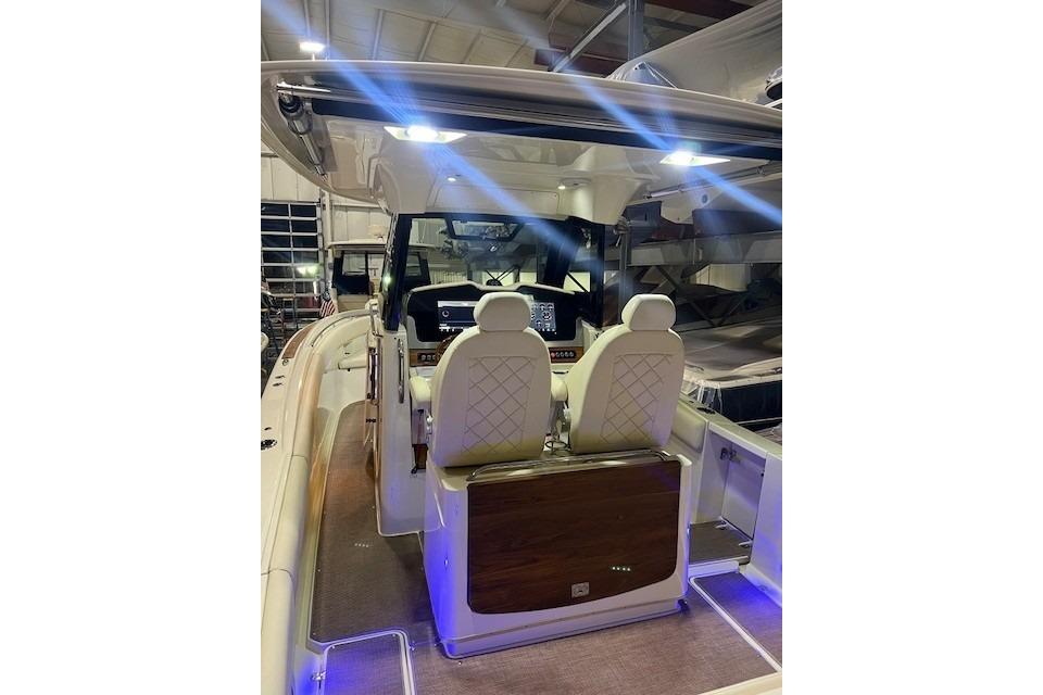 2023 Chris-Craft Catalina 30 interior with illuminated helm and luxurious seating.