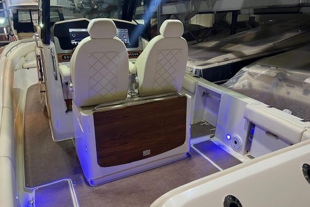 2023 Chris-Craft Catalina 30 interior with elegant seating and ambient lighting.