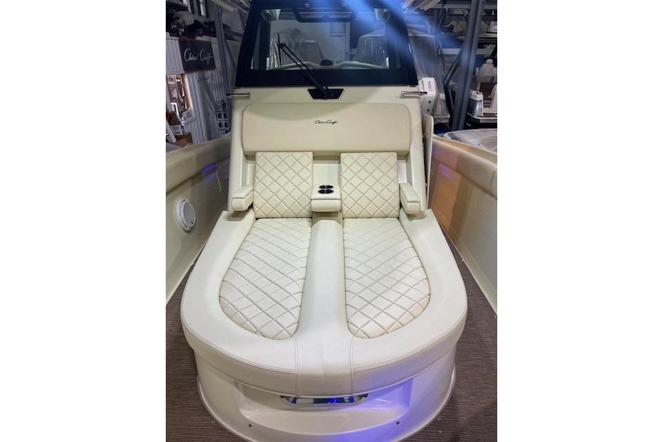 Luxurious seating on 2023 Chris-Craft Catalina 30 boat, featuring elegant quilted upholstery.