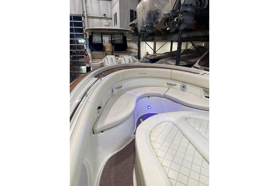 2023 Chris-Craft Catalina 30 boat interior with elegant seating and ambient lighting.