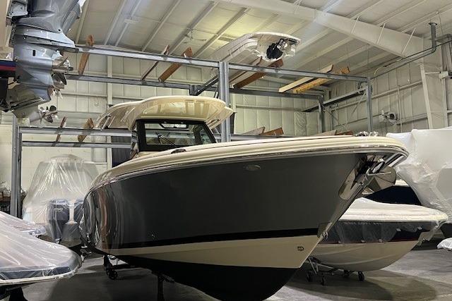 2023 Chris-Craft Catalina 30 boat in indoor storage facility.