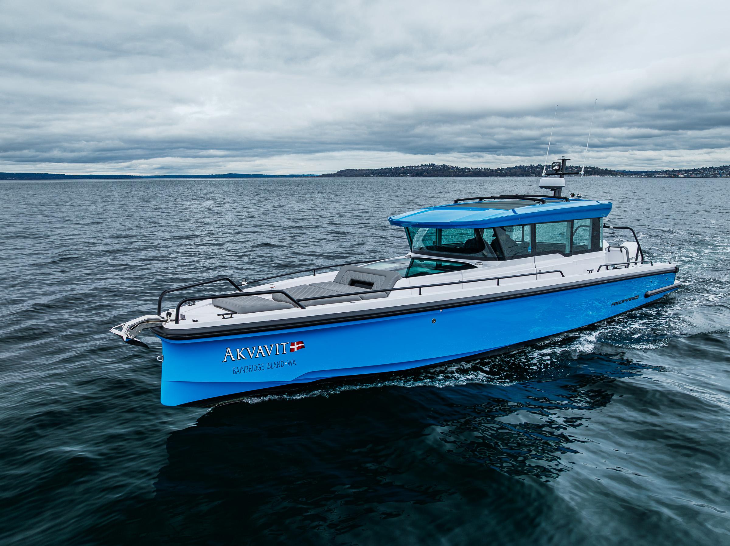 Axopar-37xc  Wetbar 2021-AQVAVIT WA-US-2021 Axopar 37xc Wetbar boat cruising on open water under cloudy skies.-9703795