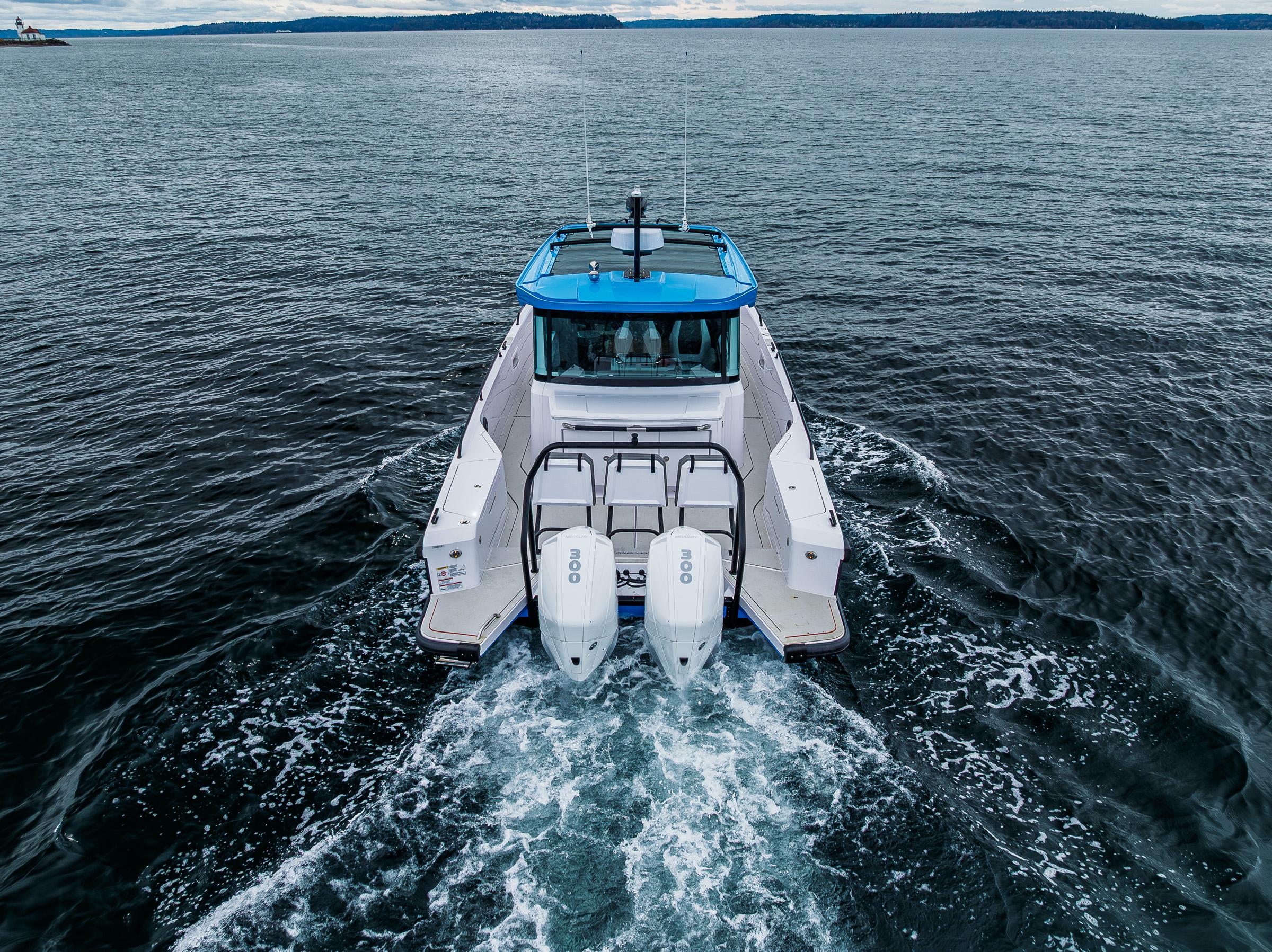 Axopar-37xc  Wetbar 2021-AQVAVIT WA-US-2021 Axopar 37xc Wetbar cruising on open water, rear view.-9703795 | Thumbnail