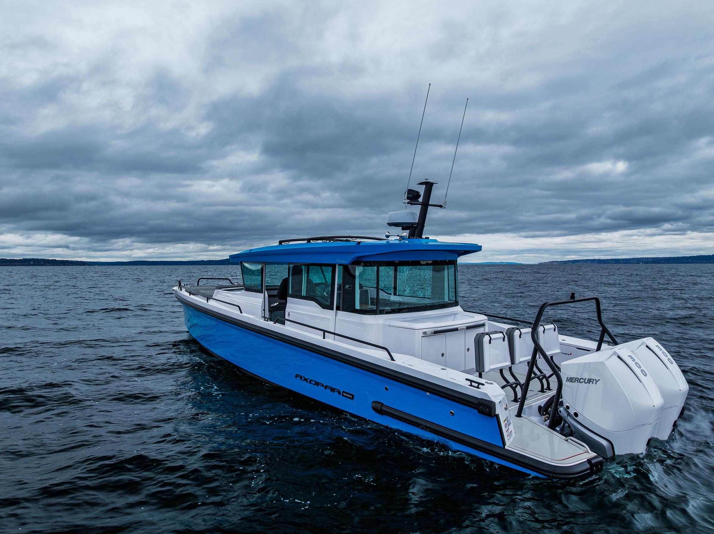 Axopar-37xc  Wetbar 2021-AQVAVIT WA-US-2021 Axopar 37xc Wetbar boat on open water under cloudy skies.-9703795 | Thumbnail