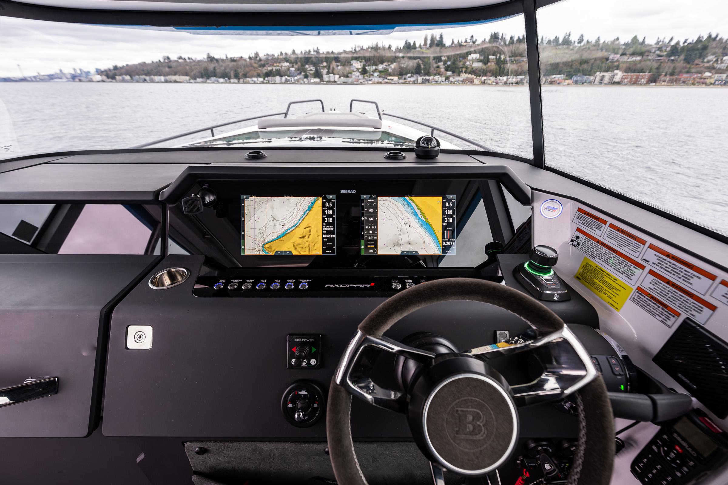Axopar-37xc  Wetbar 2021-AQVAVIT WA-US-2021 Axopar 37xc Wetbar boat dashboard with navigation screens on a calm lake.-9703795 | Thumbnail
