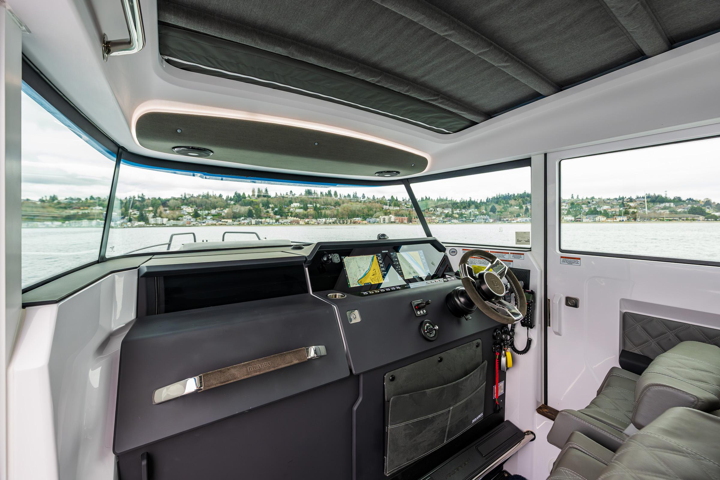 Axopar-37xc  Wetbar 2021-AQVAVIT WA-US-2021 Axopar 37xc Wetbar interior with modern helm and panoramic windows.-9703795 | Thumbnail