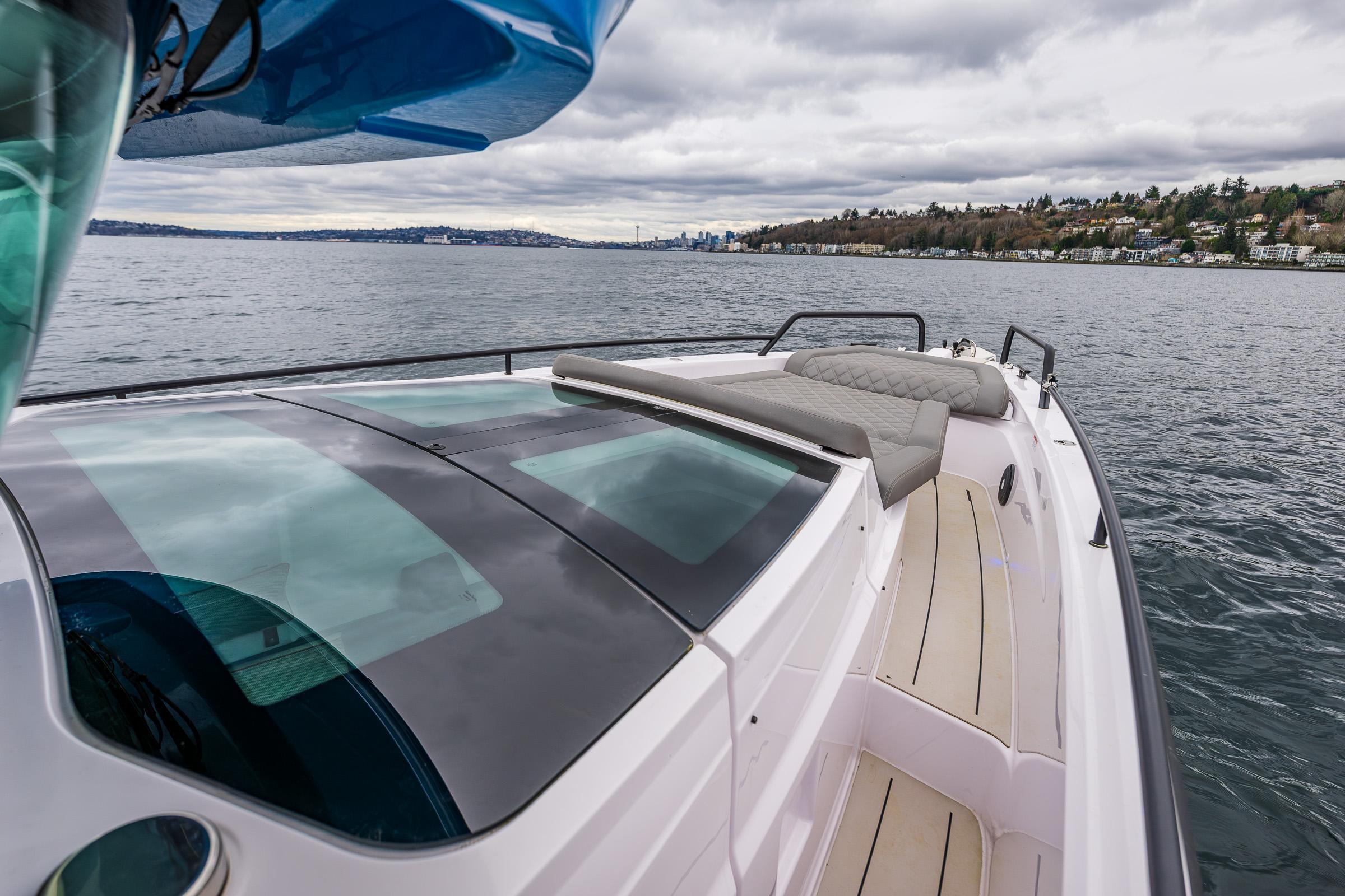 Axopar-37xc  Wetbar 2021-AQVAVIT WA-US-2021 Axopar 37xc Wetbar boat cruising on a scenic lake under cloudy skies.-9703795 | Thumbnail