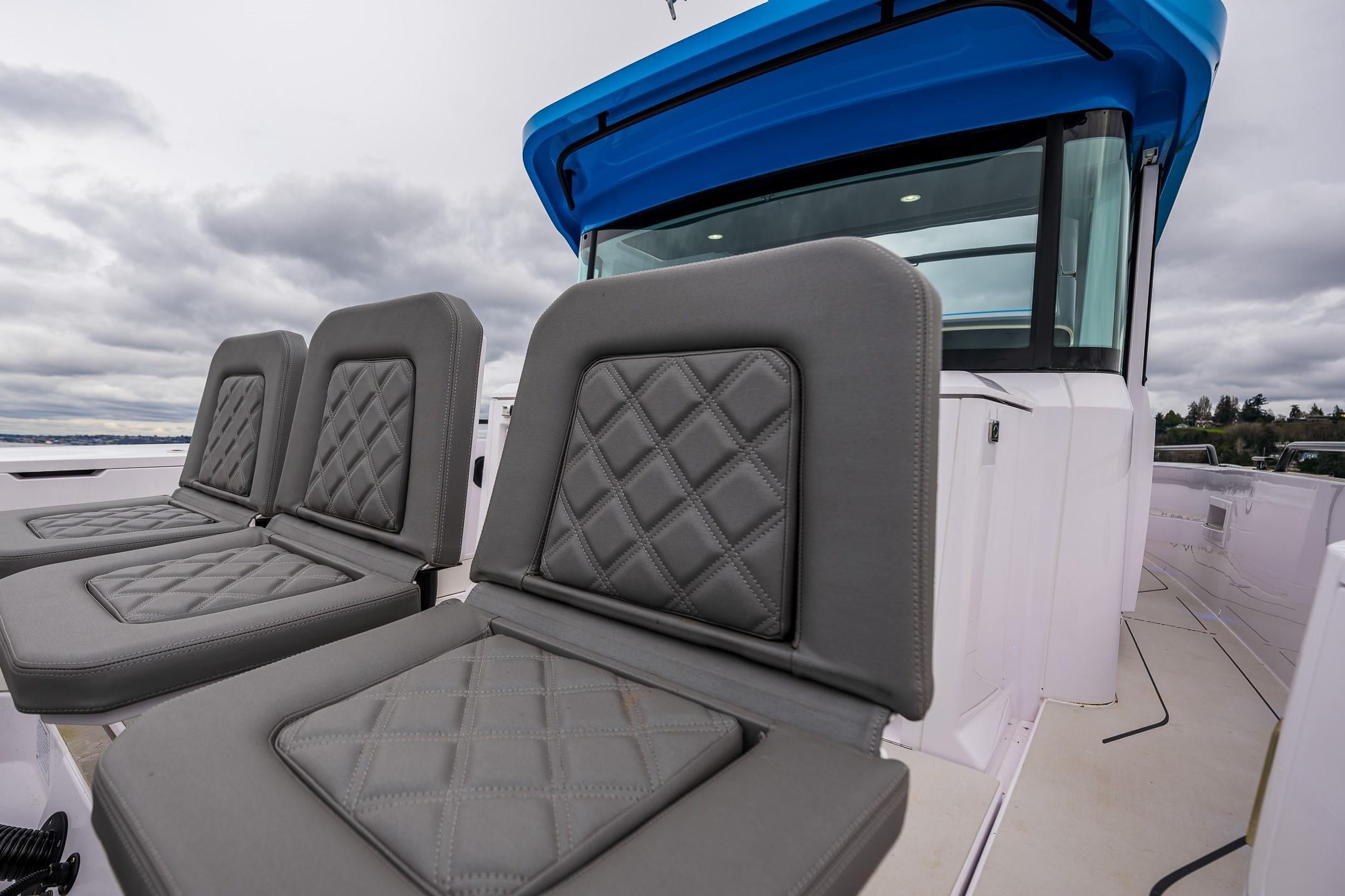 Axopar-37xc  Wetbar 2021-AQVAVIT WA-US-2021 Axopar 37xc Wetbar boat with gray quilted seats and blue canopy.-9703795 | Thumbnail