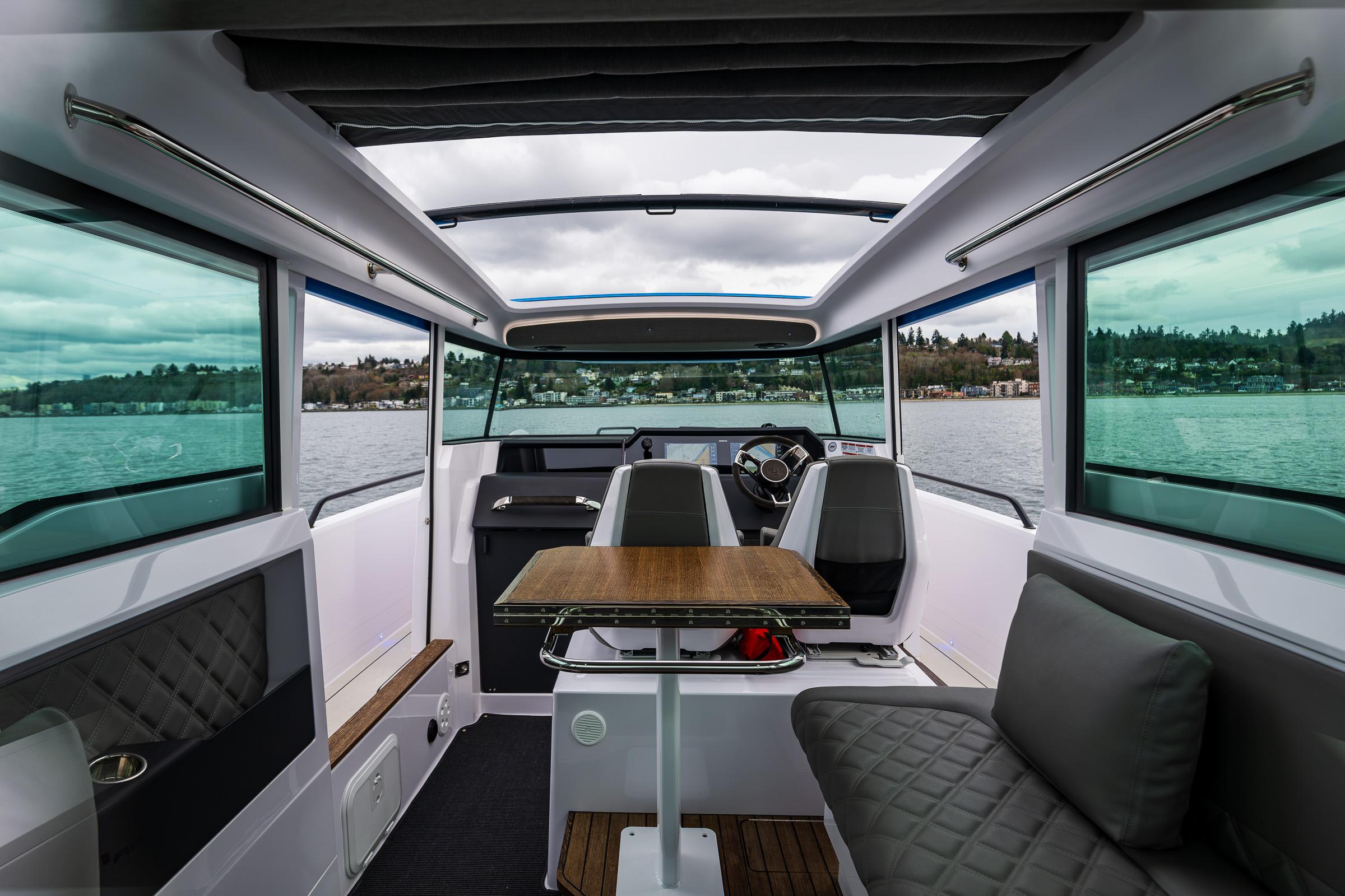 Axopar-37xc  Wetbar 2021-AQVAVIT WA-US-Interior of 2021 Axopar 37xc Wetbar boat with modern seating and panoramic windows.-9703795 | Thumbnail