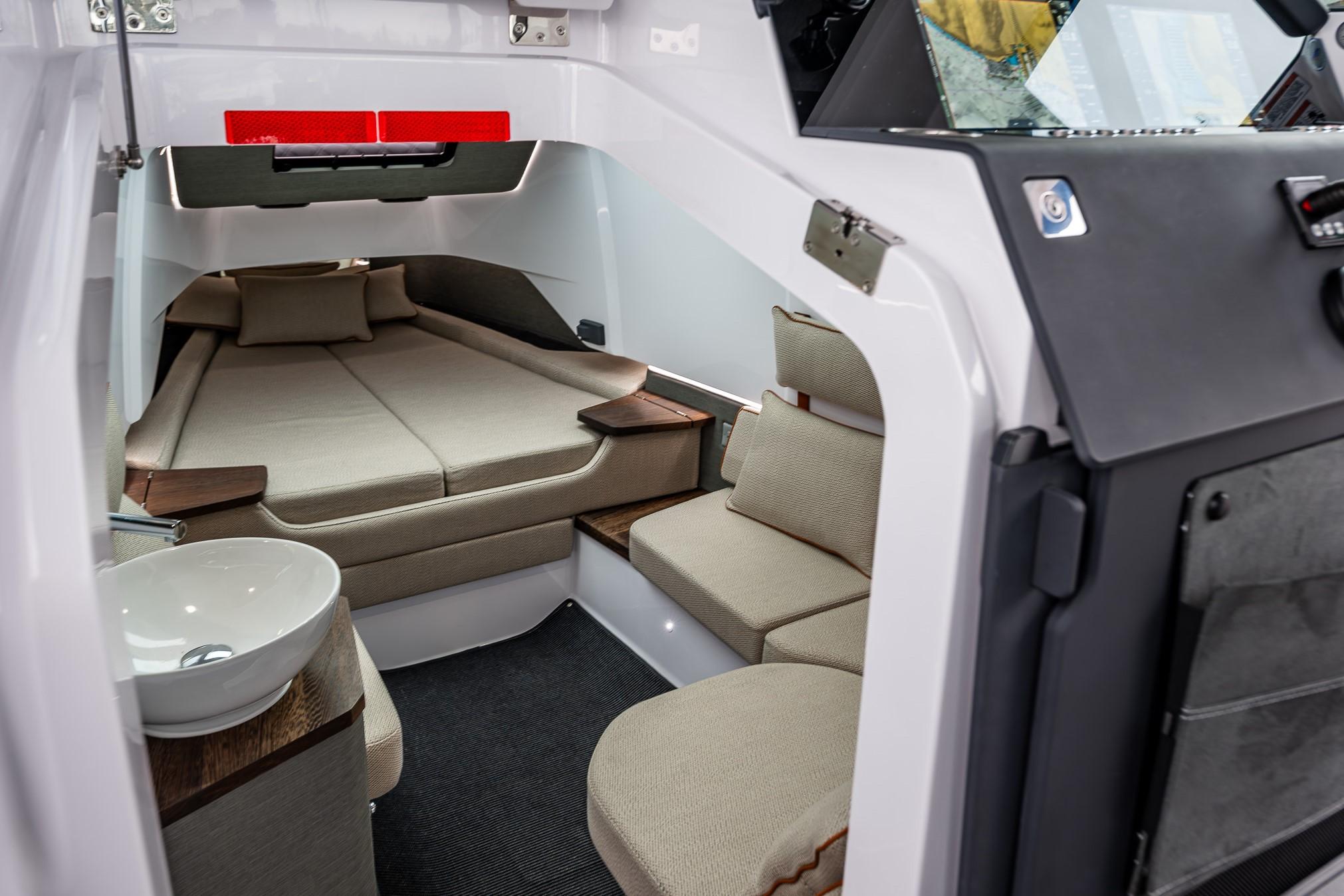 Axopar-37xc  Wetbar 2021-AQVAVIT WA-US-2021 Axopar 37xc Wetbar cabin interior with seating, bed, and sink.-9703795 | Thumbnail