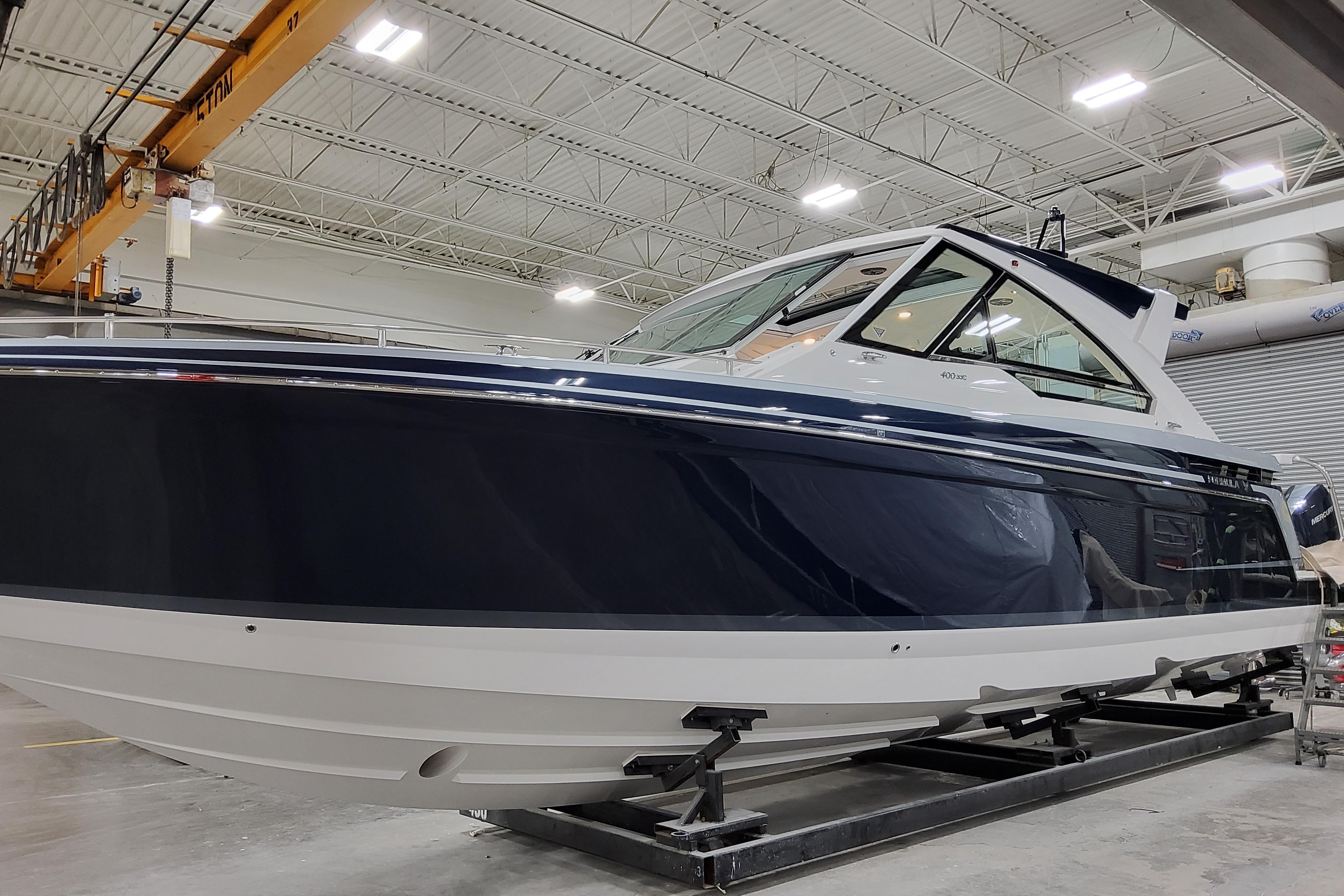 2026 Formula 400 Super Sport Crossover boat in a warehouse setting.
