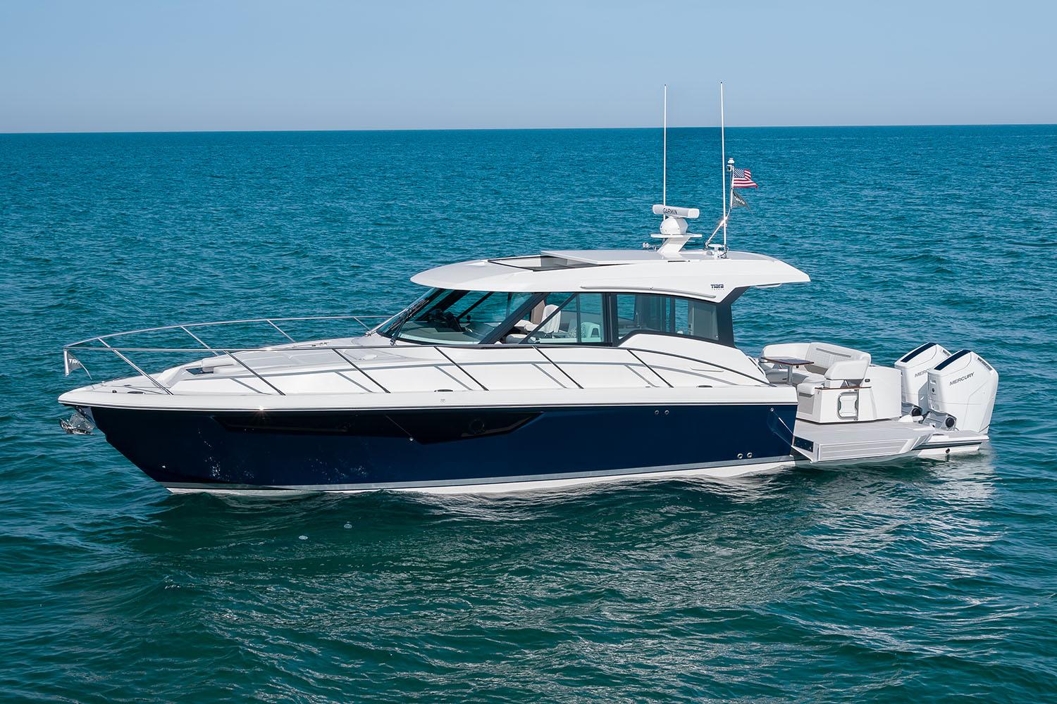 Manufacturer Provided Image: 2025 Tiara Yachts 43 LE cruising on open water under clear skies.