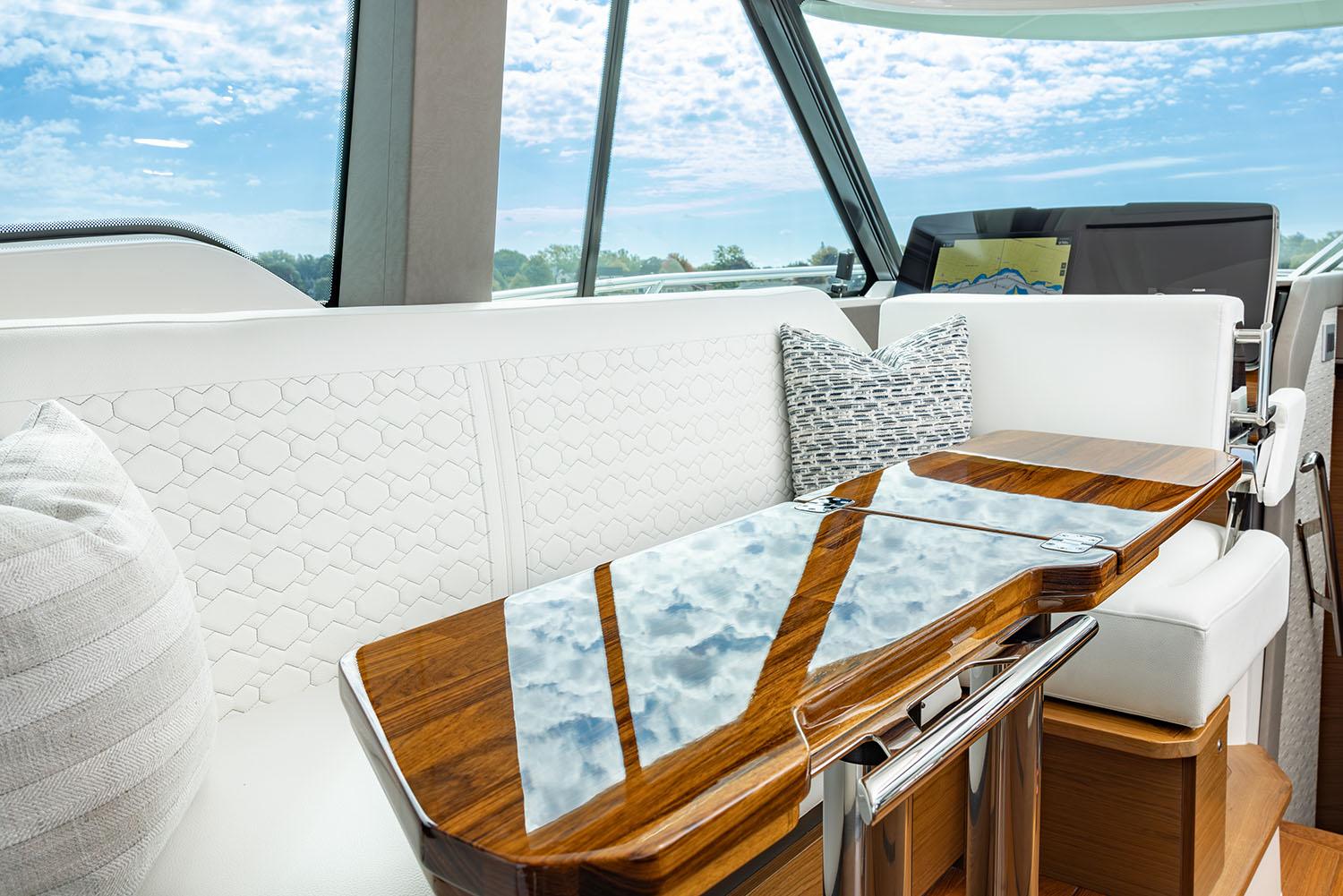 Manufacturer Provided Image: Luxurious interior of 2025 Tiara Yachts 43 LE with elegant seating and wooden table.