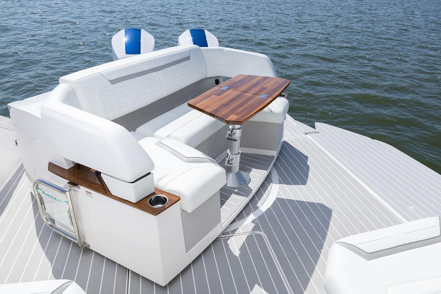 Manufacturer Provided Image: 2025 Tiara Yachts 43 LE luxury seating area with wooden table on deck.