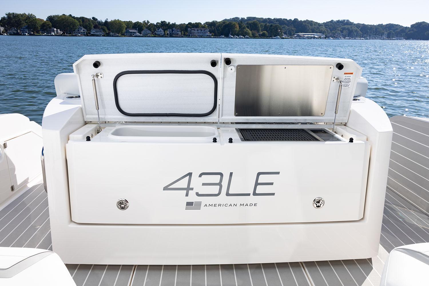 Manufacturer Provided Image: 2025 Tiara Yachts 43 LE boat deck with storage compartments, on a serene lake.