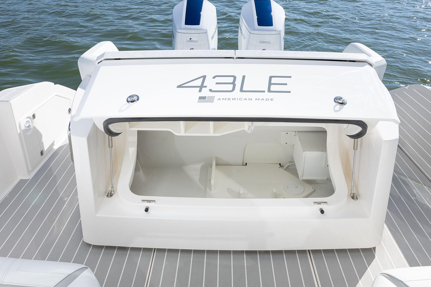 Manufacturer Provided Image: 2025 Tiara Yachts 43 LE boat storage compartment, open on deck, near water.
