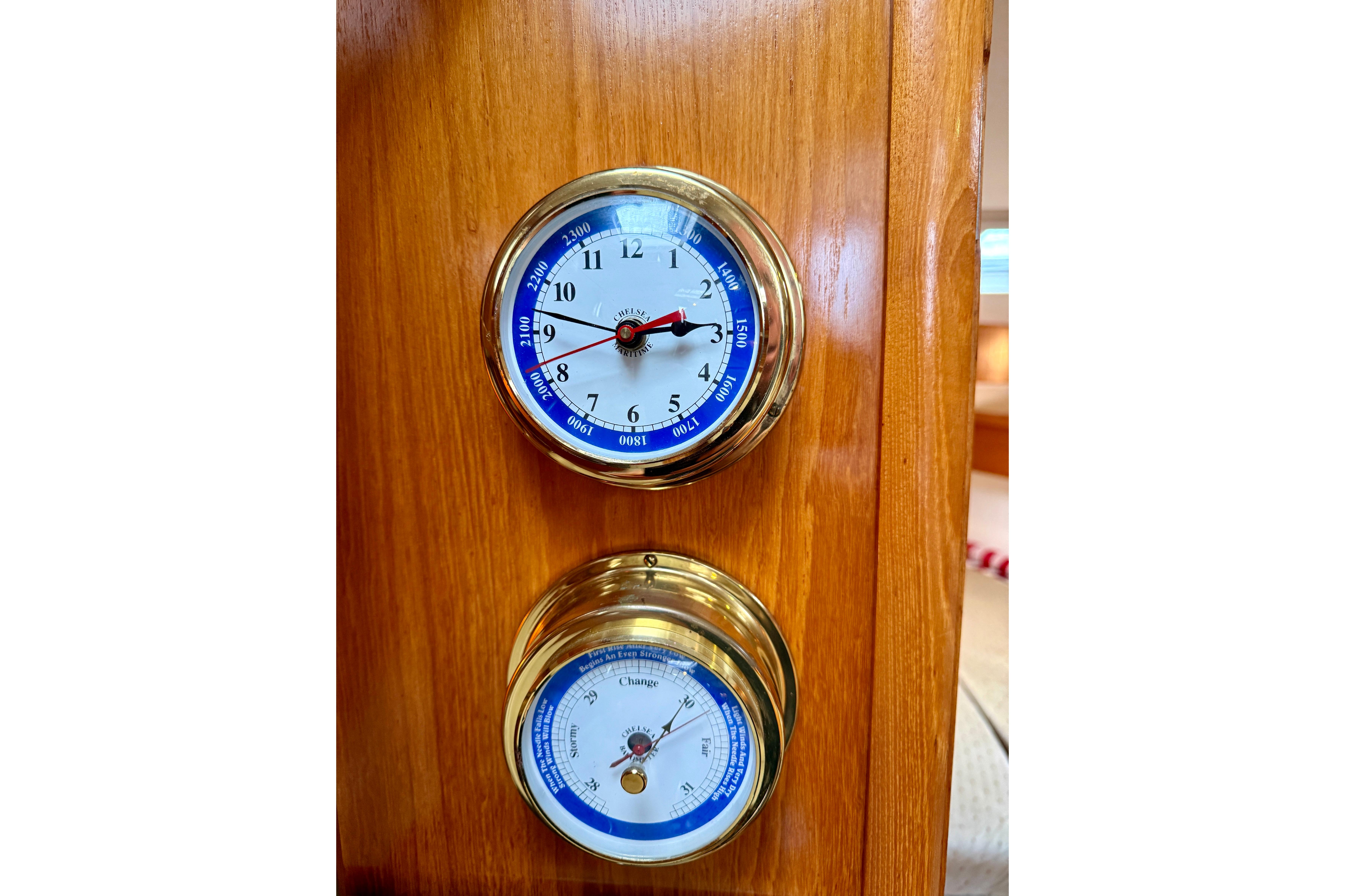 Brass clock and barometer on Jeanneau Sun Odyssey 36.2 yacht, 1997 model.