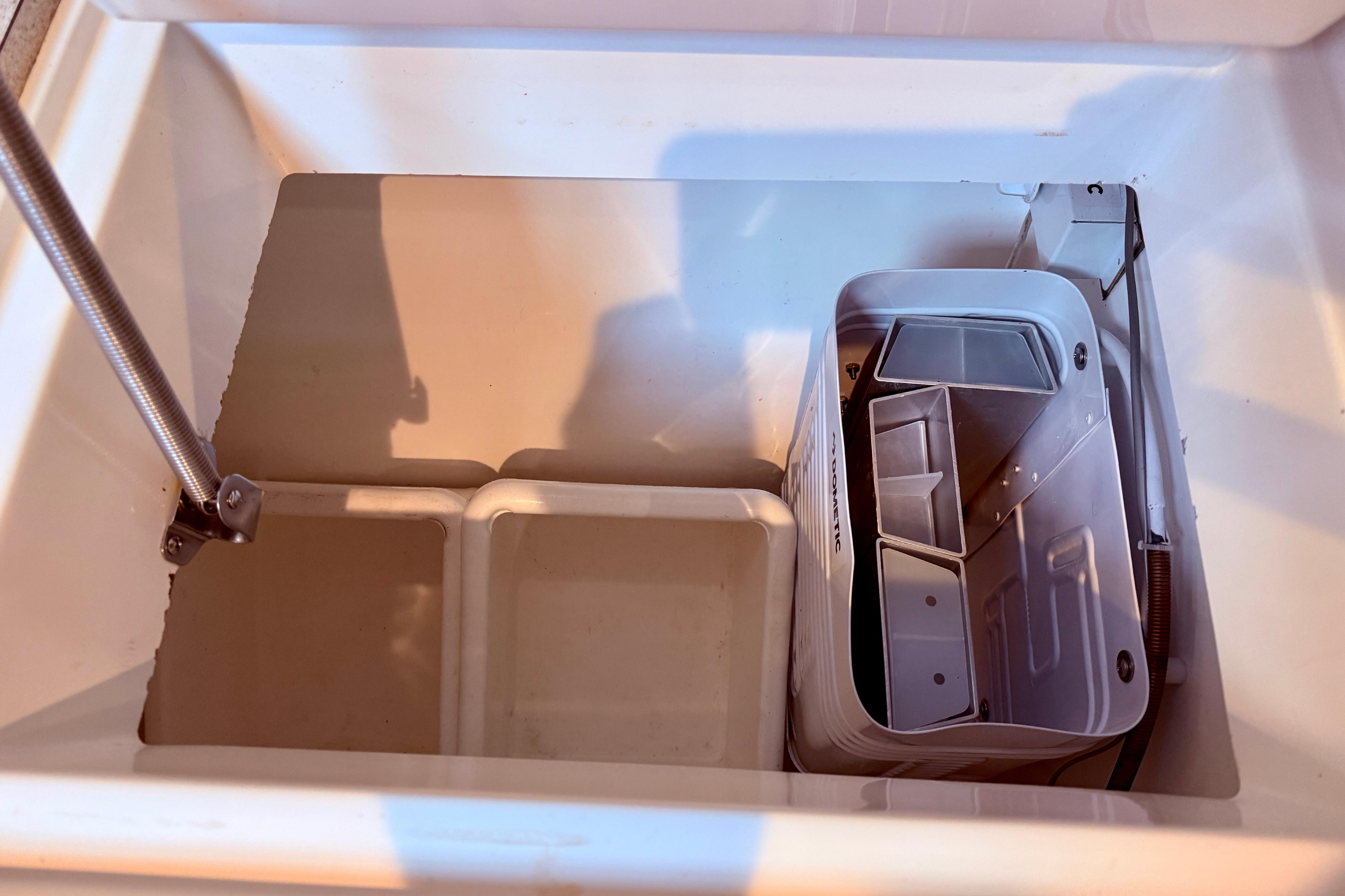 Storage compartment on a 1997 Jeanneau Sun Odyssey 36.2 sailboat, featuring organized space.