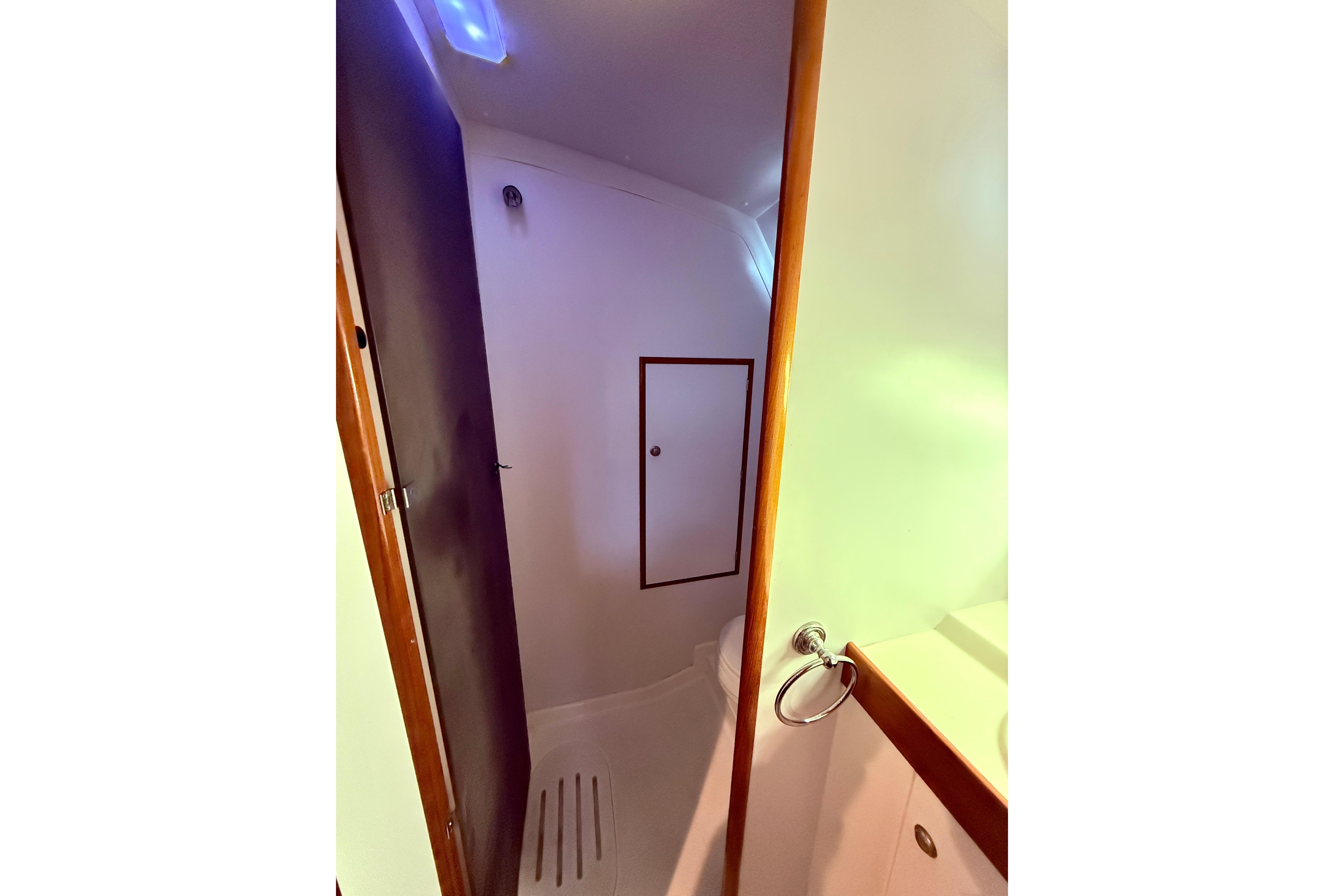 Bathroom interior of 1997 Jeanneau Sun Odyssey 36.2 sailboat, featuring compact design.