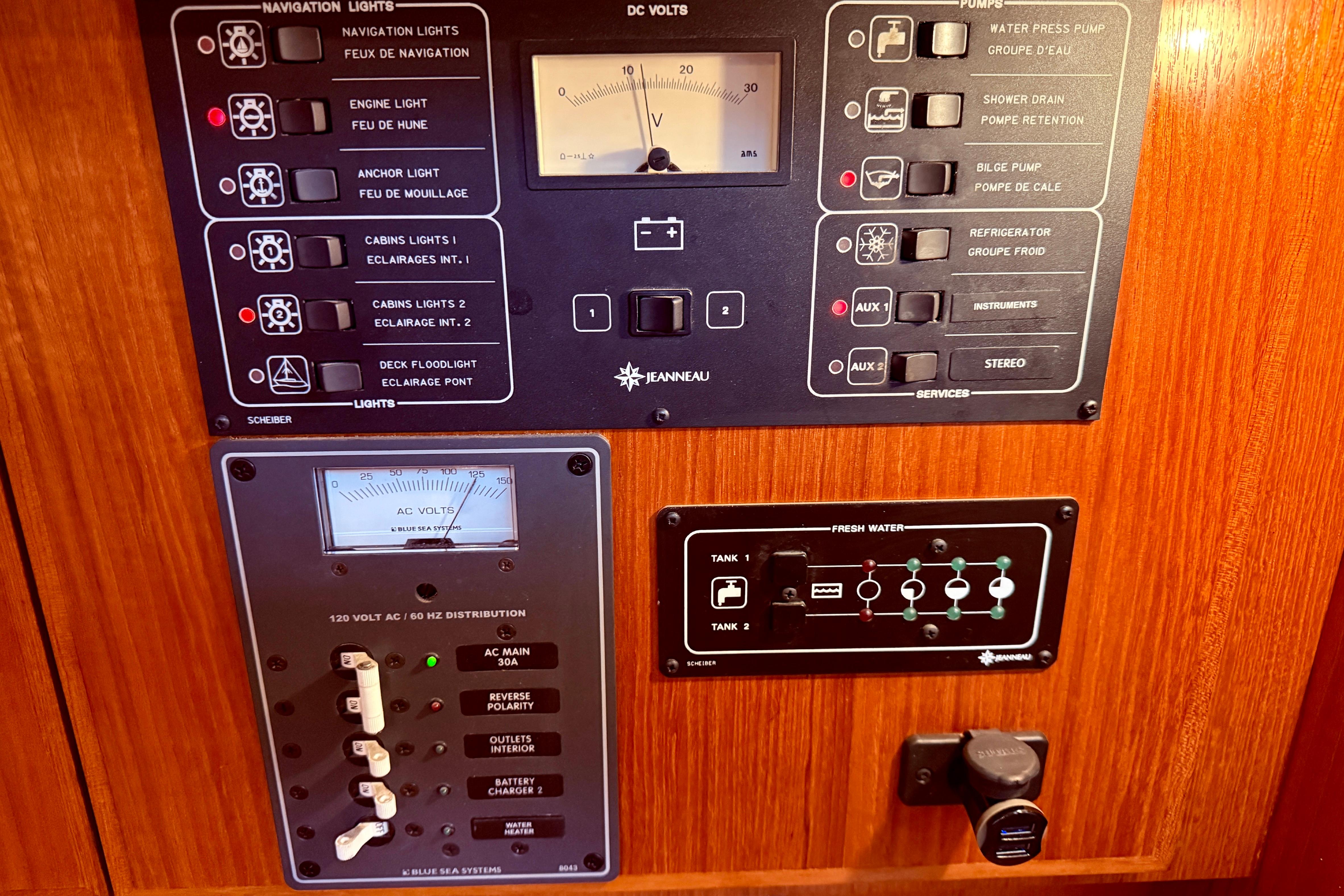 Control panel of a 1997 Jeanneau Sun Odyssey 36.2 sailboat, featuring navigation and electrical systems.