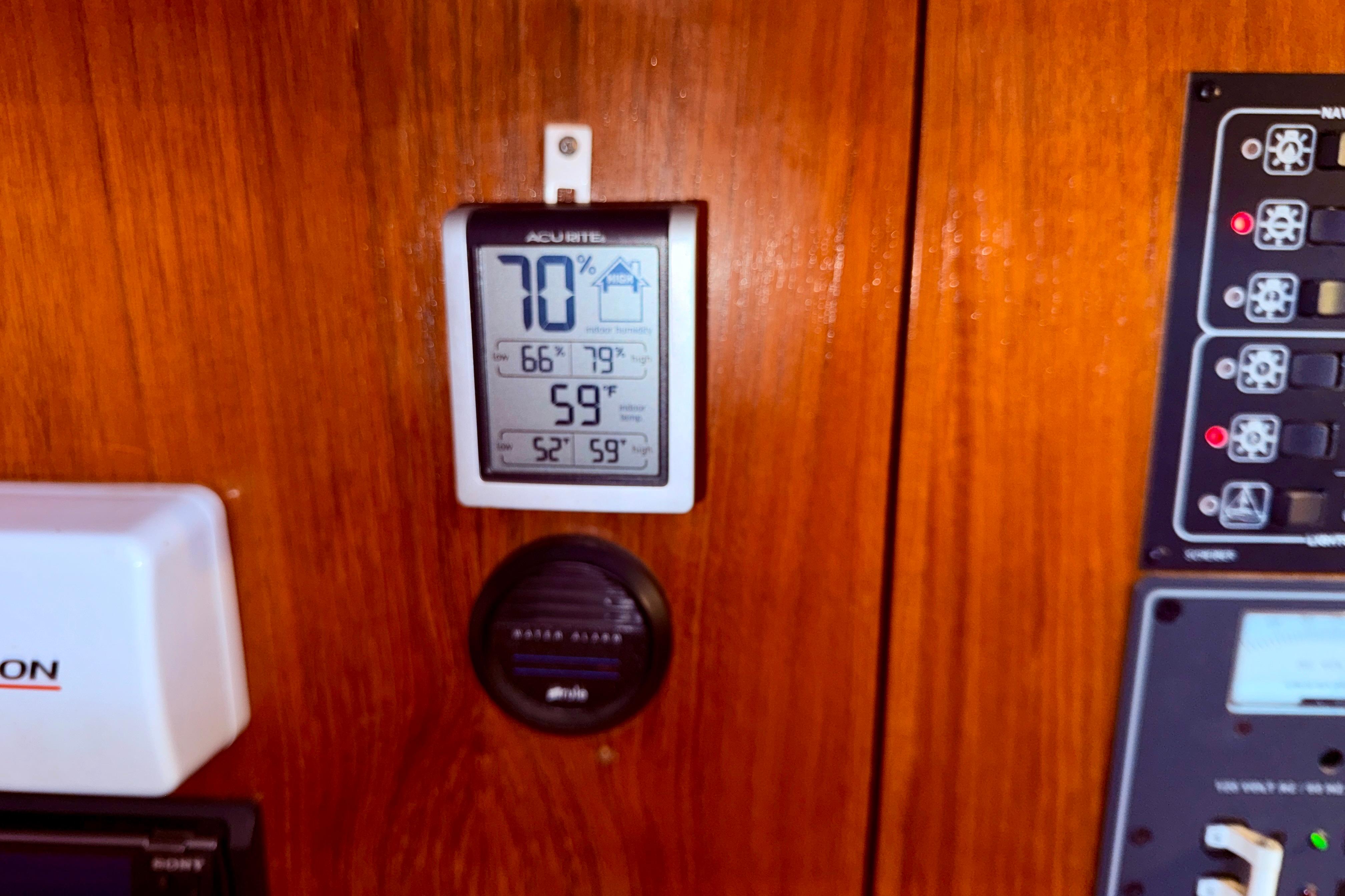 Control panel on 1997 Jeanneau Sun Odyssey 36.2 yacht with temperature and humidity display.