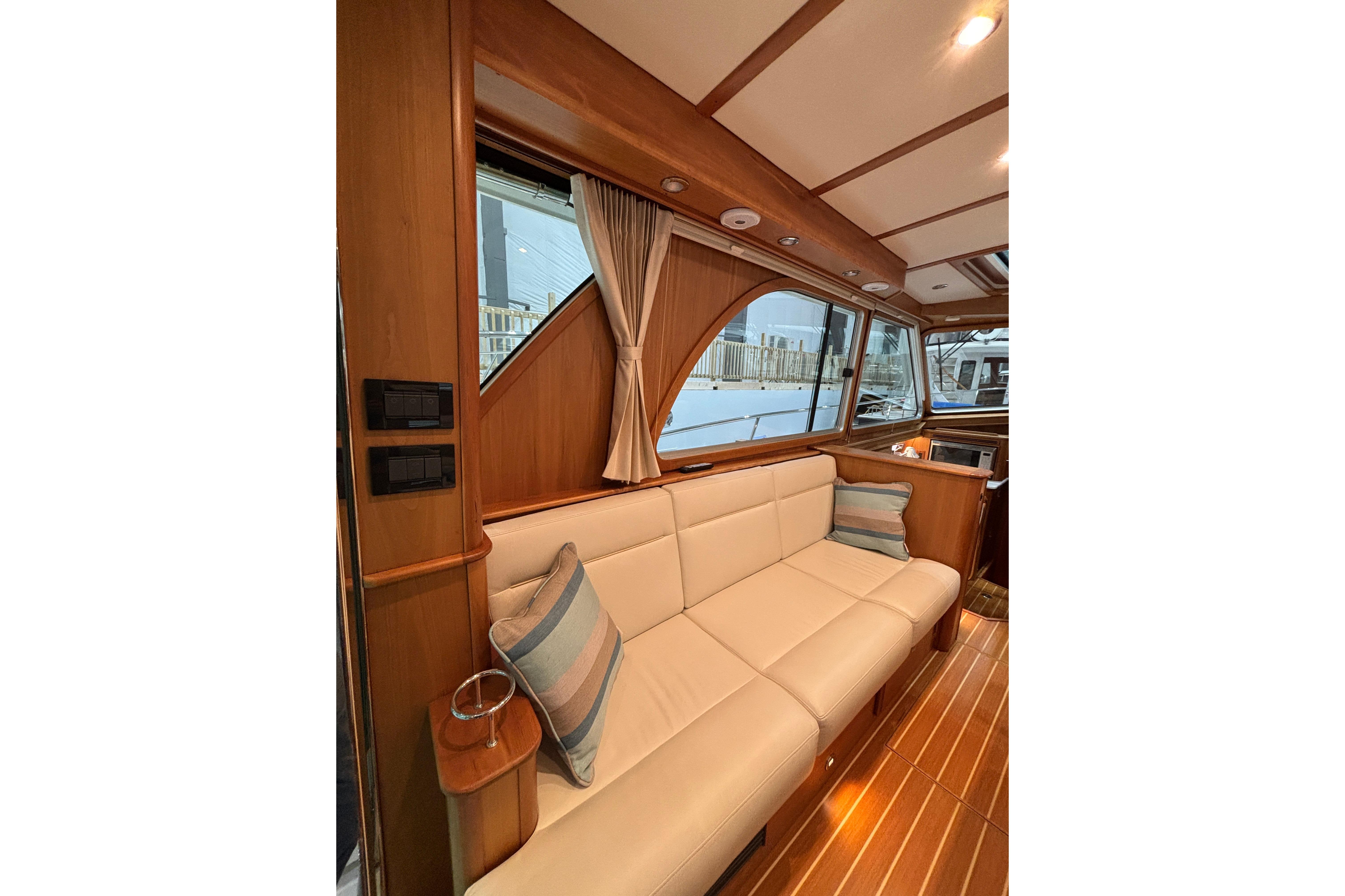 Interior of 2020 Sabre 45 Salon Express yacht with elegant wood finish and plush seating.