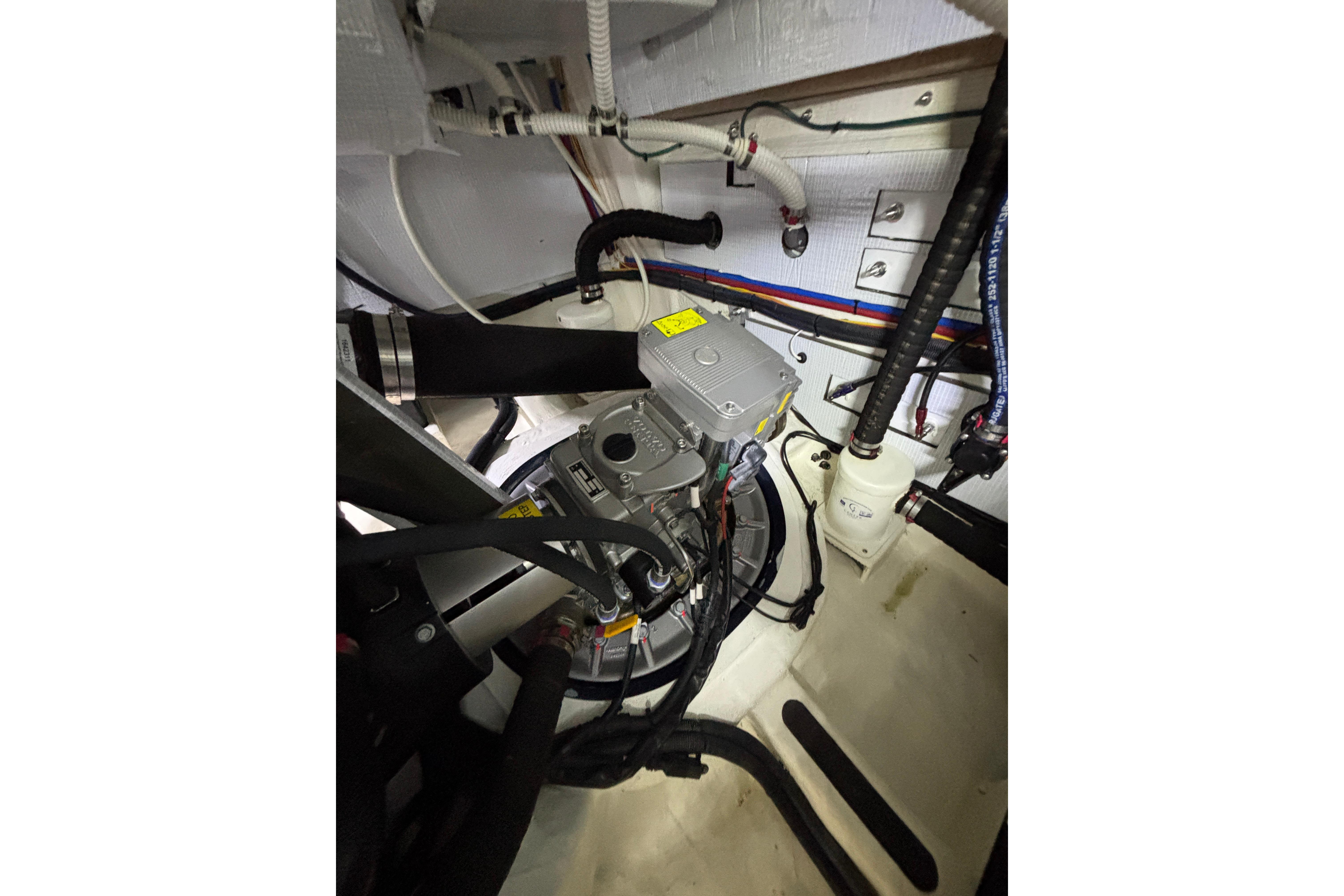 Engine room of 2020 Sabre 45 Salon Express with visible mechanical components and wiring.
