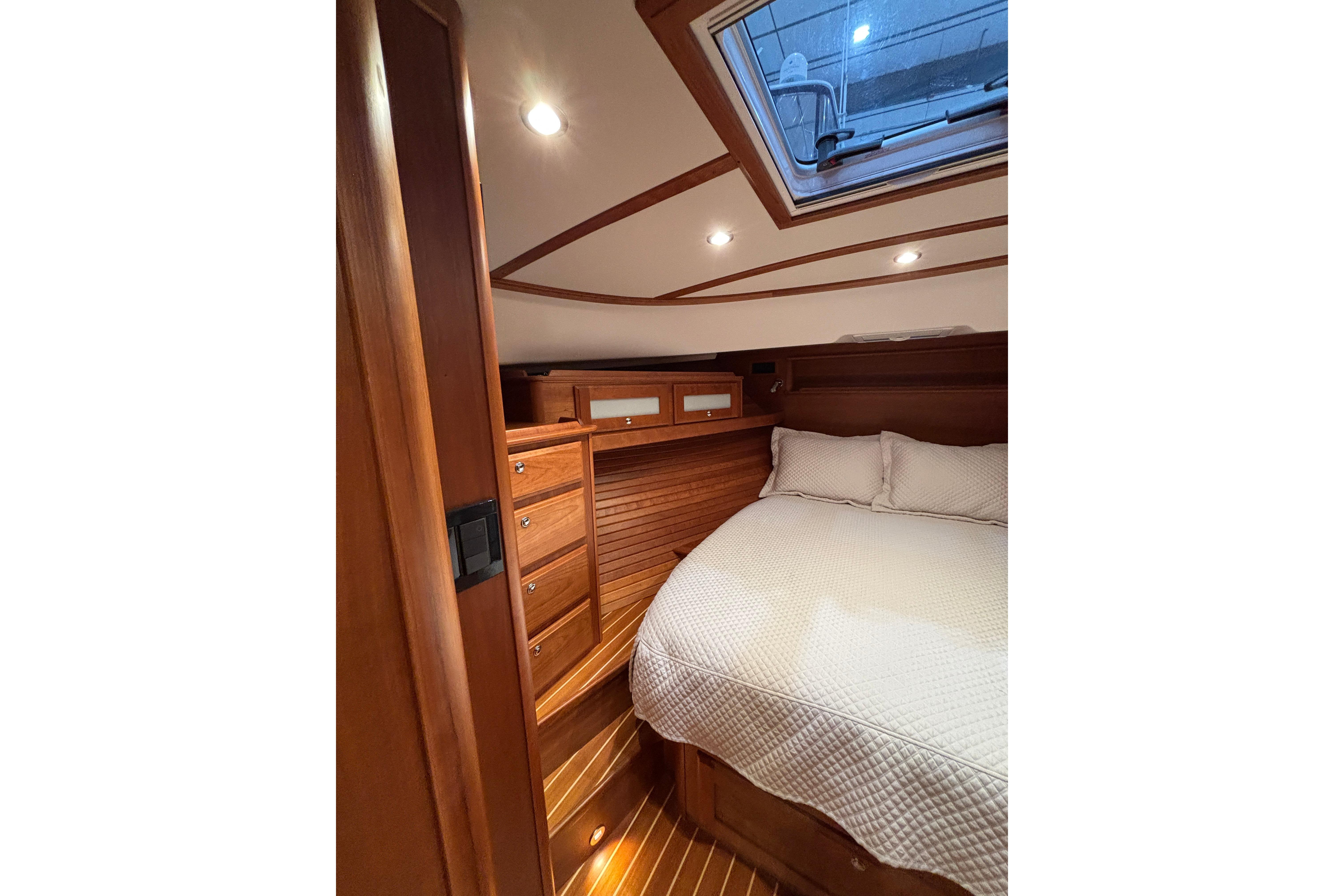 Luxurious cabin interior of 2020 Sabre 45 Salon Express yacht with wood finish and skylight.