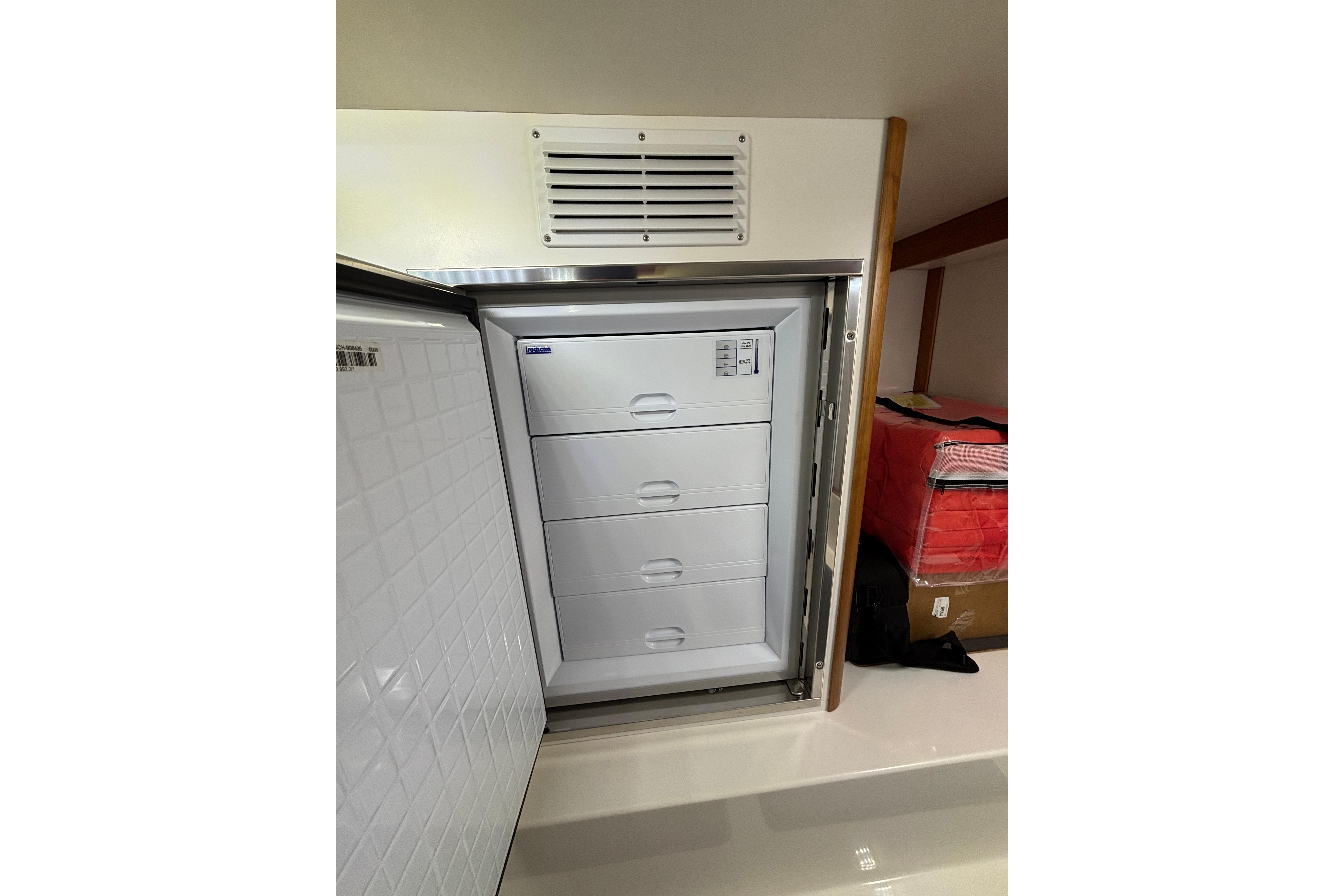 Freezer drawers inside 2020 Sabre 45 Salon Express yacht, showcasing storage space.
