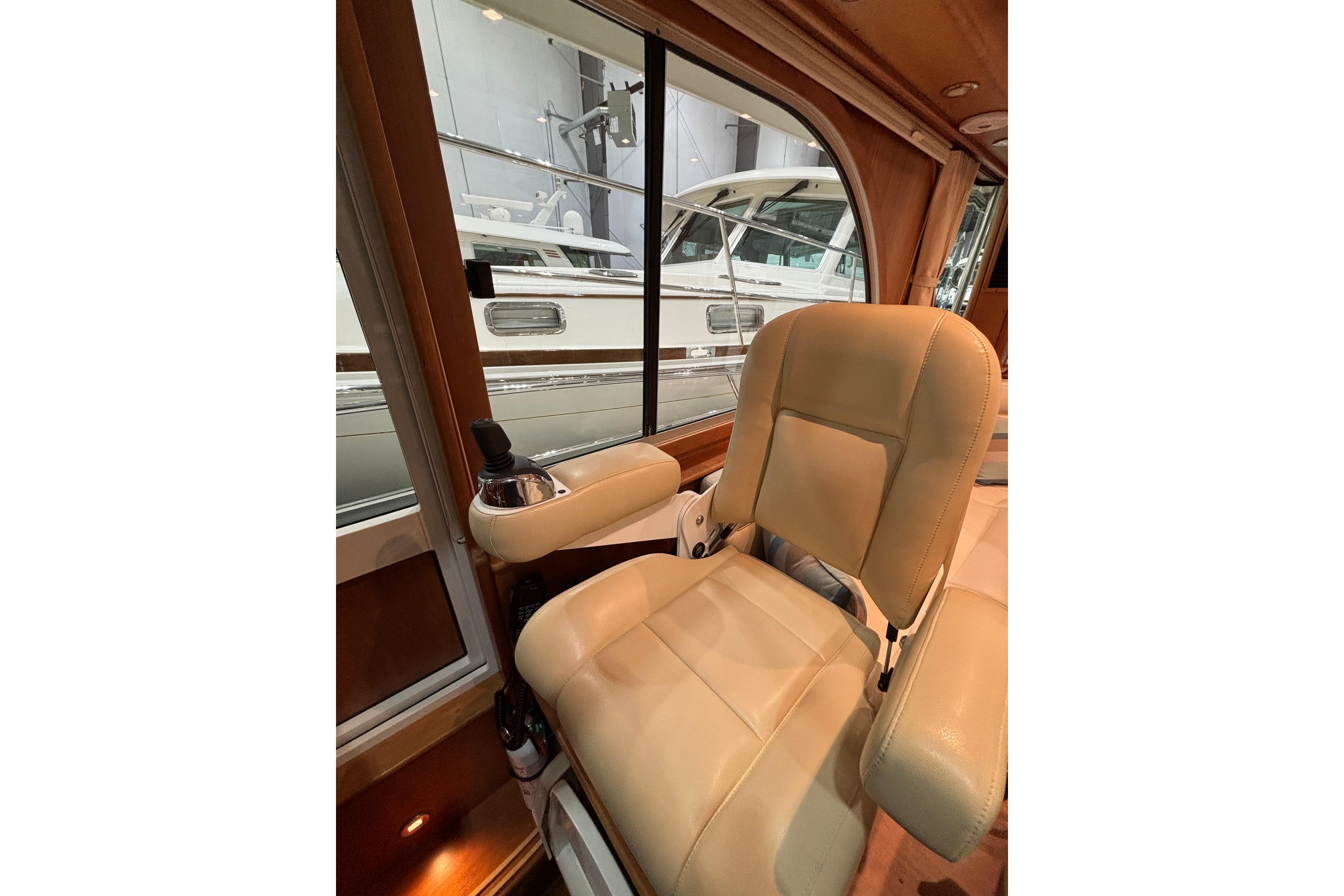 Interior of 2020 Sabre 45 Salon Express, featuring a luxurious beige captainu0027s chair.