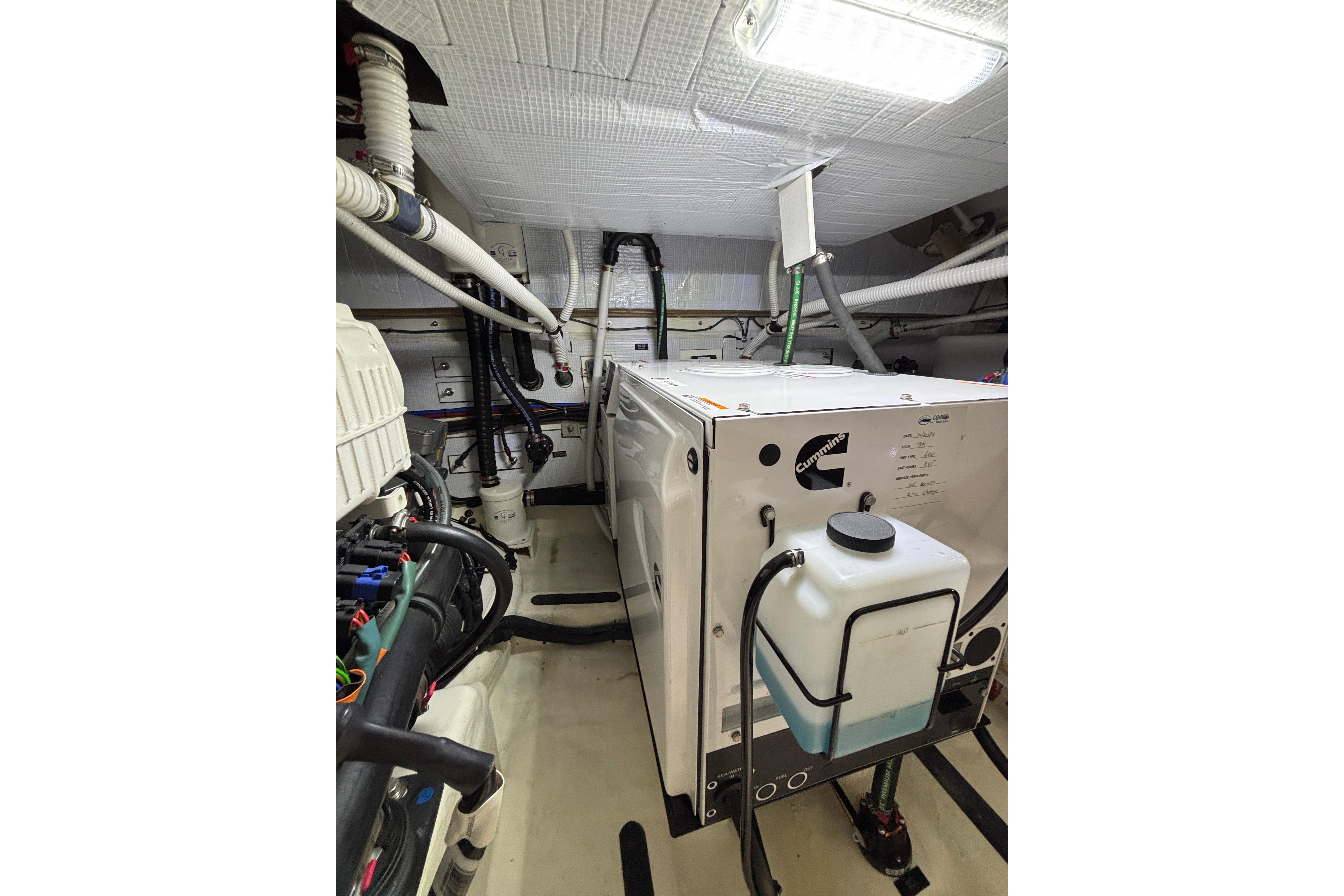 Engine room of 2020 Sabre 45 Salon Express with Cummins generator and piping.
