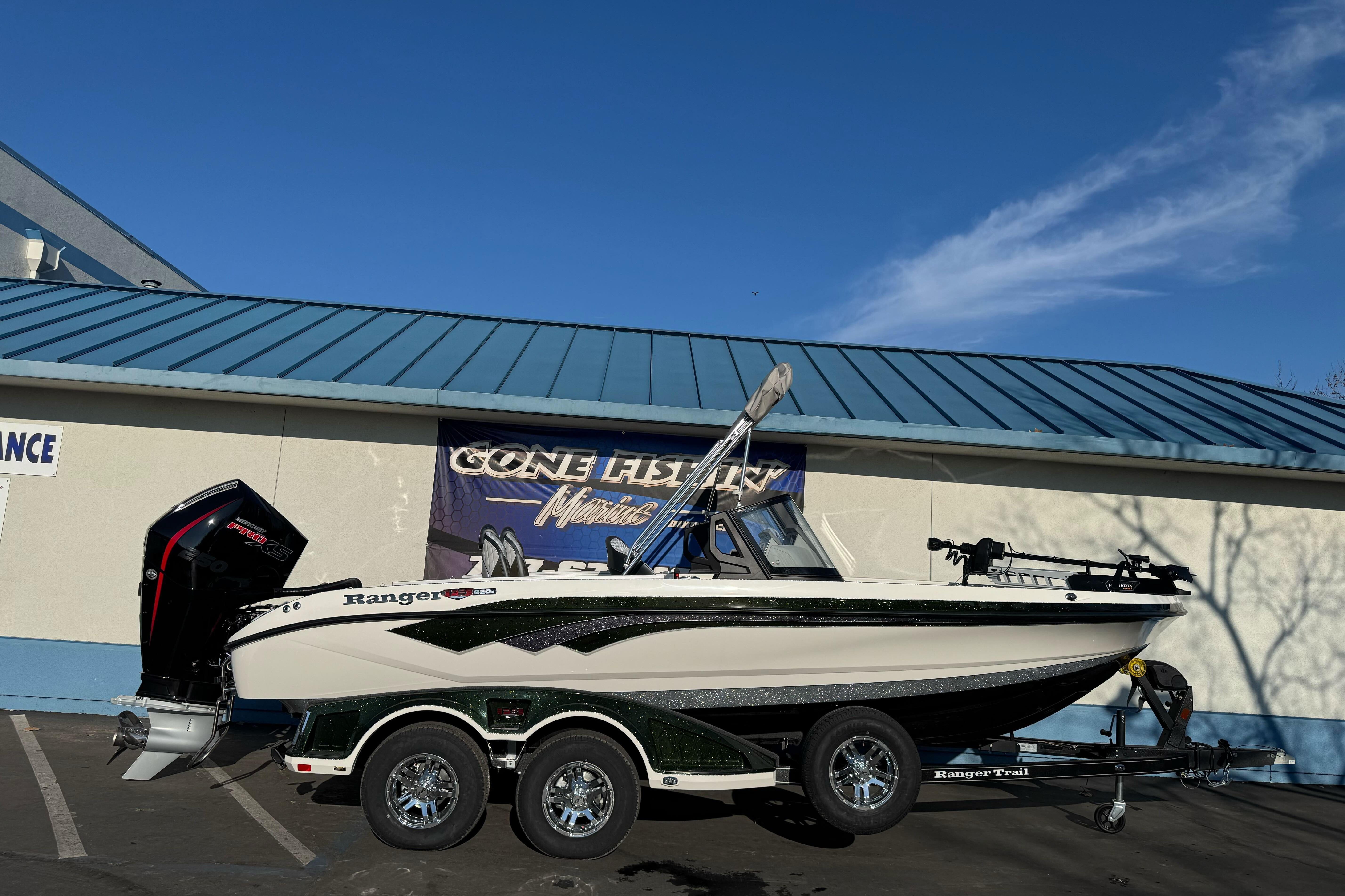 2026 Ranger 620xFS Pro fishing boat on trailer, parked outdoors.