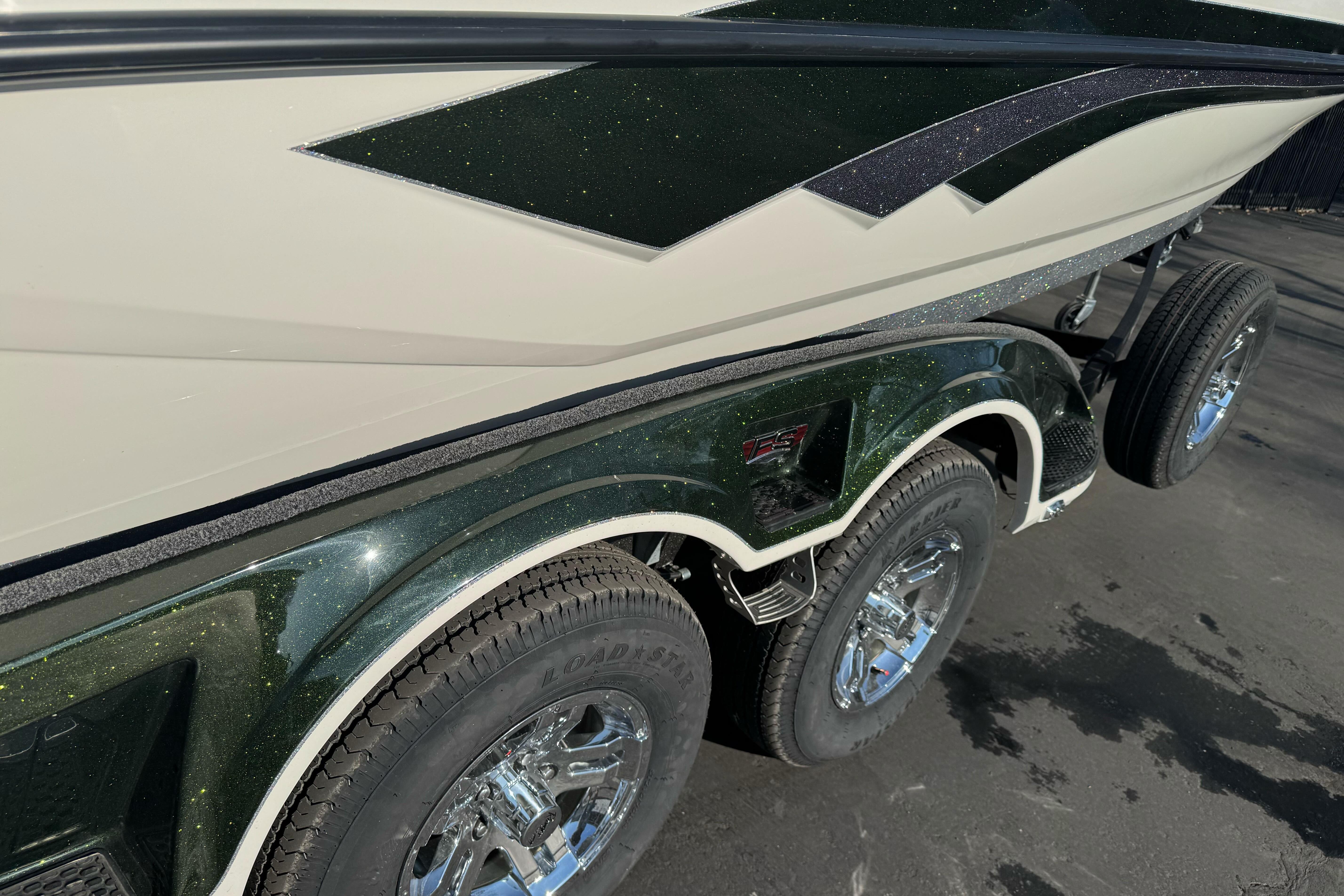 2026 Ranger 620xFS Pro boat trailer with dual axles and chrome wheels.