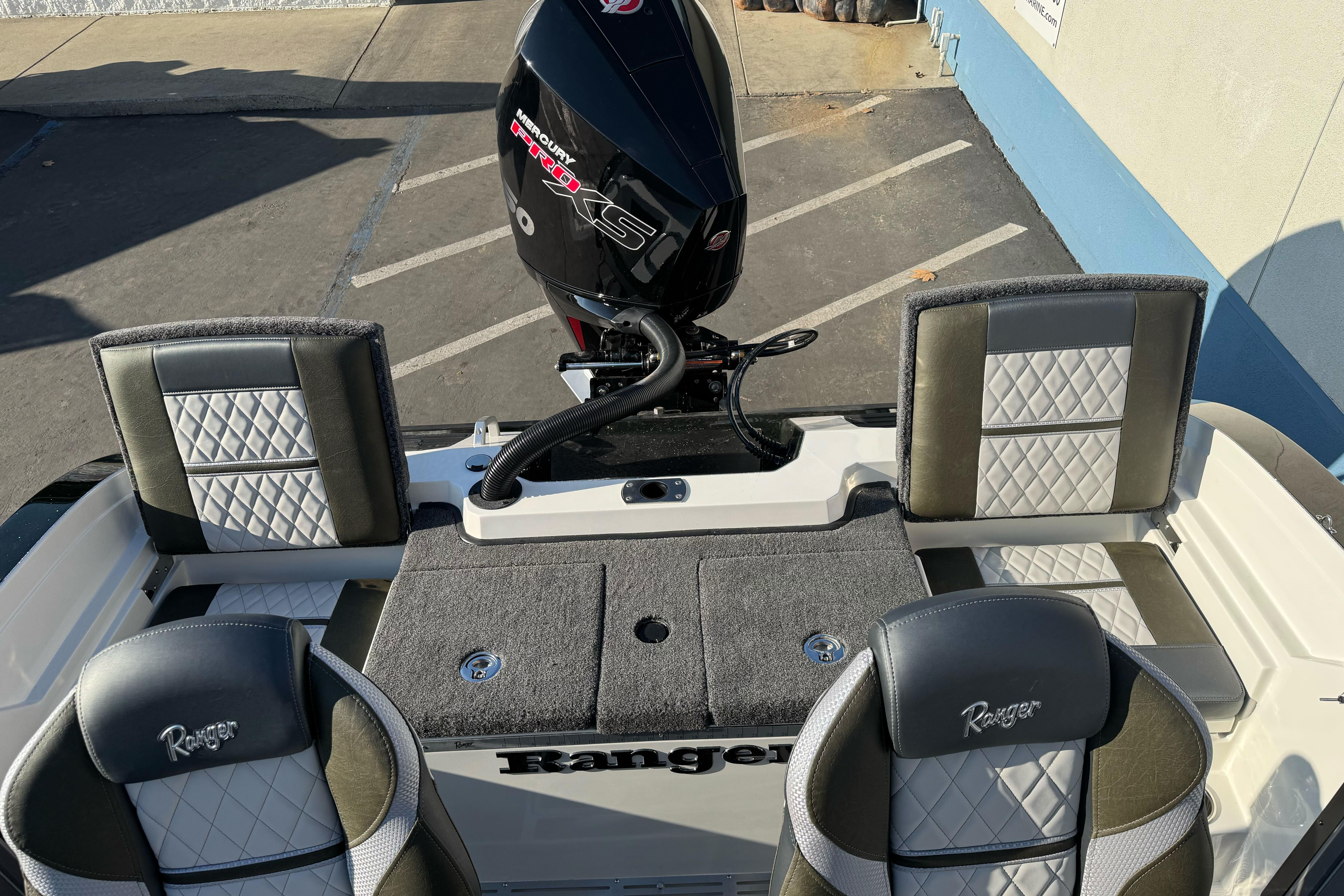 2026 Ranger 620xFS Pro boat interior with Mercury engine, featuring stylish seating and storage.