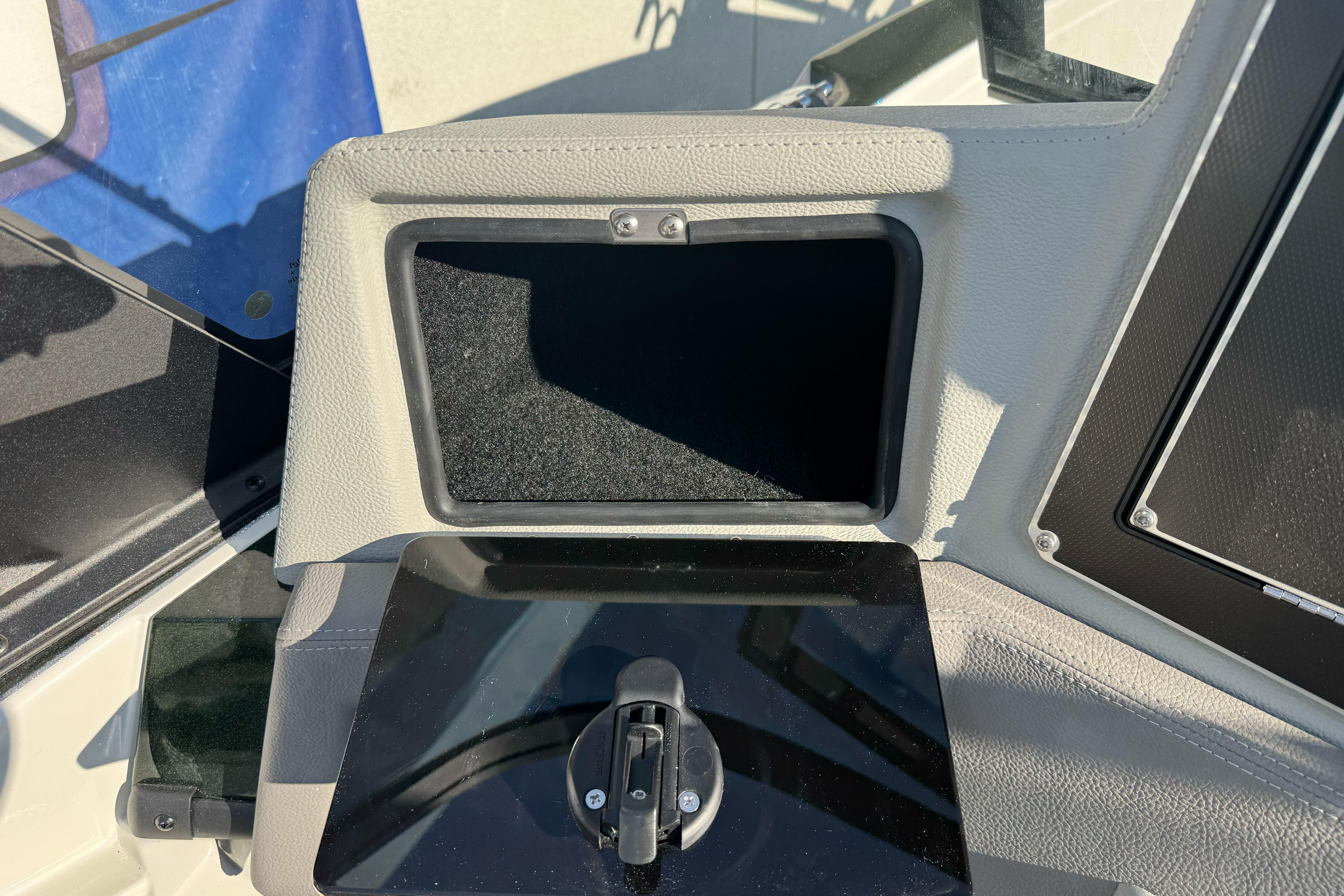 Control panel of 2026 Ranger 620xFS Pro boat, featuring a storage compartment.