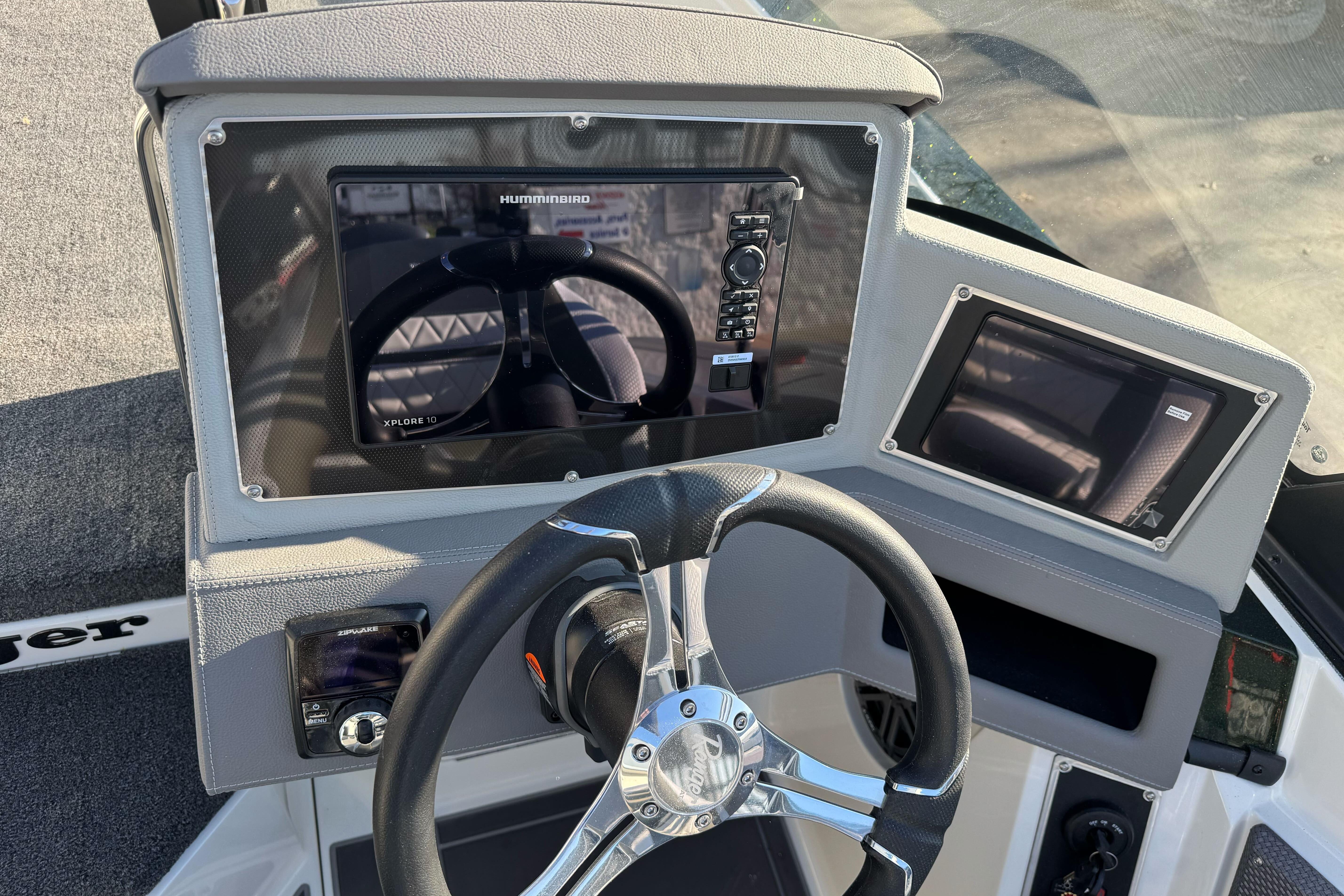 2026 Ranger 620xFS Pro boat dashboard with steering wheel and electronic displays.