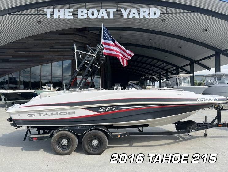 2016 Tahoe 215 boat on trailer at The Boat Yard, American flag displayed.