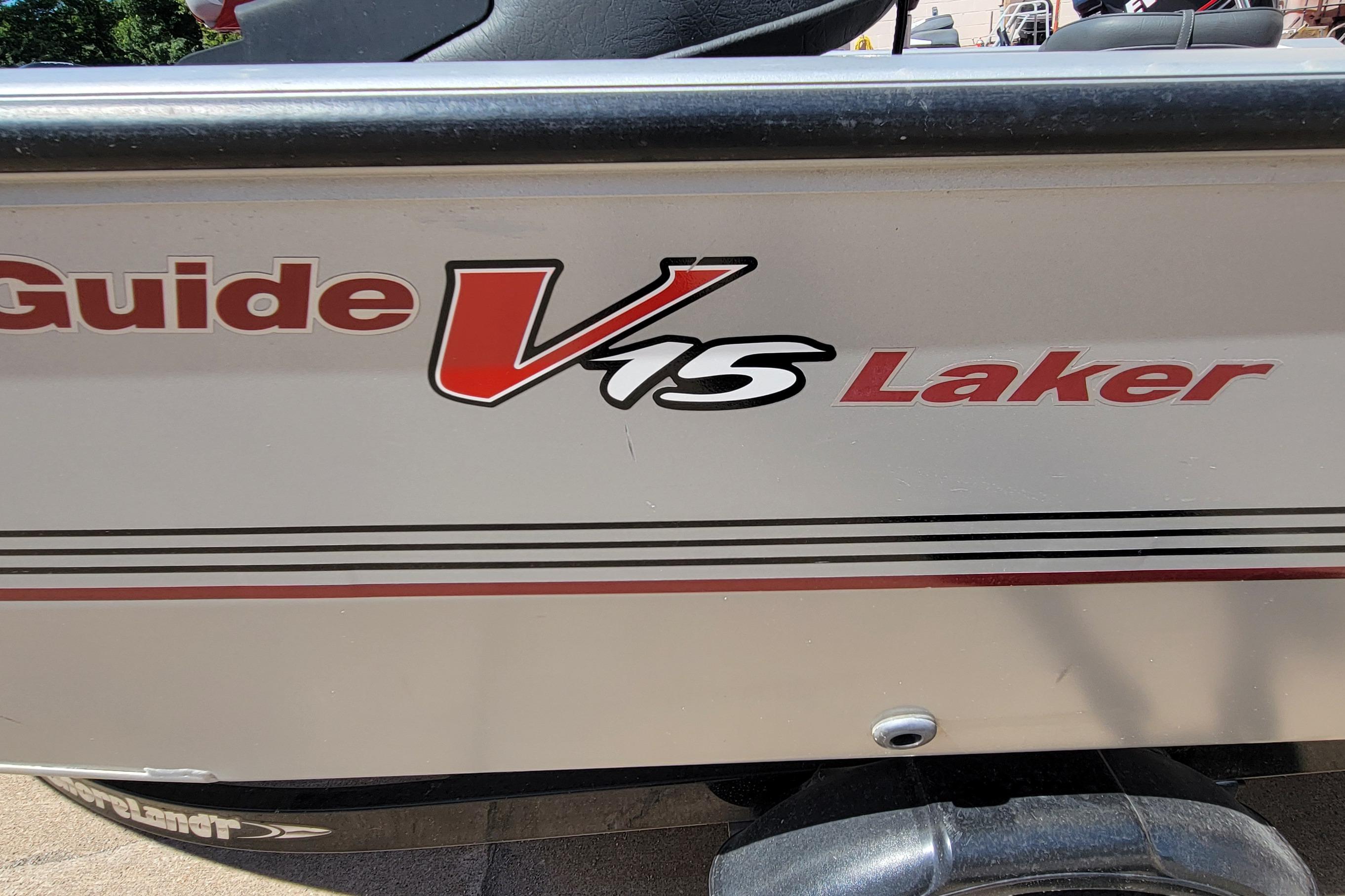 2010 Tracker Guide V 15 Laker boat side view with logo and design details.