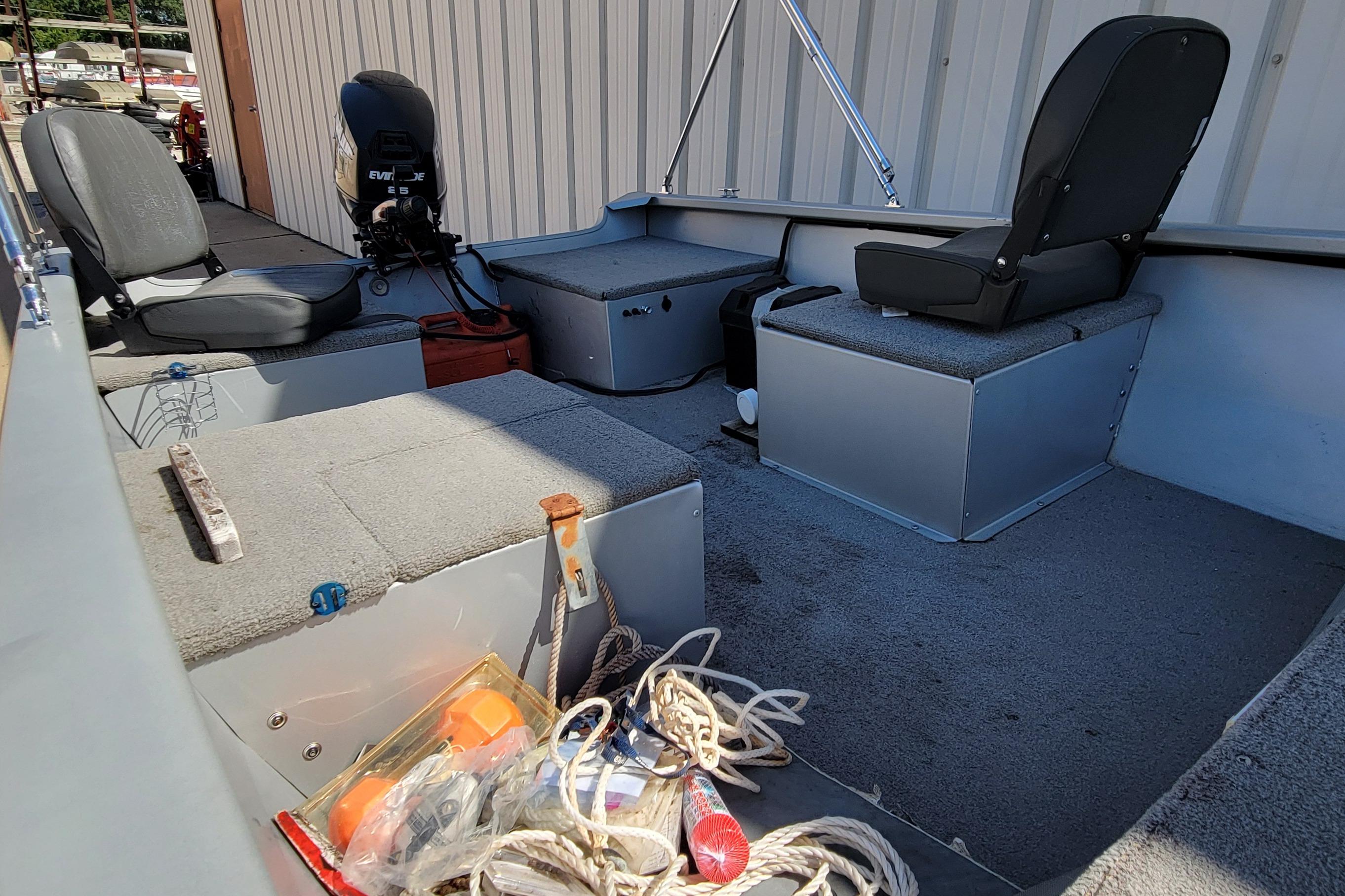 2010 Tracker Guide V 15 Laker boat interior with seats and equipment.