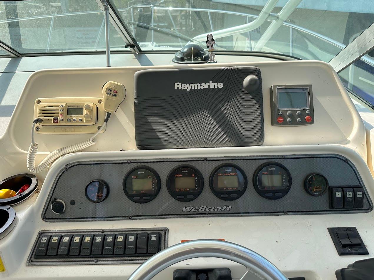 Dashboard of 2006 Wellcraft 290 Coastal boat with Raymarine electronics and gauges.