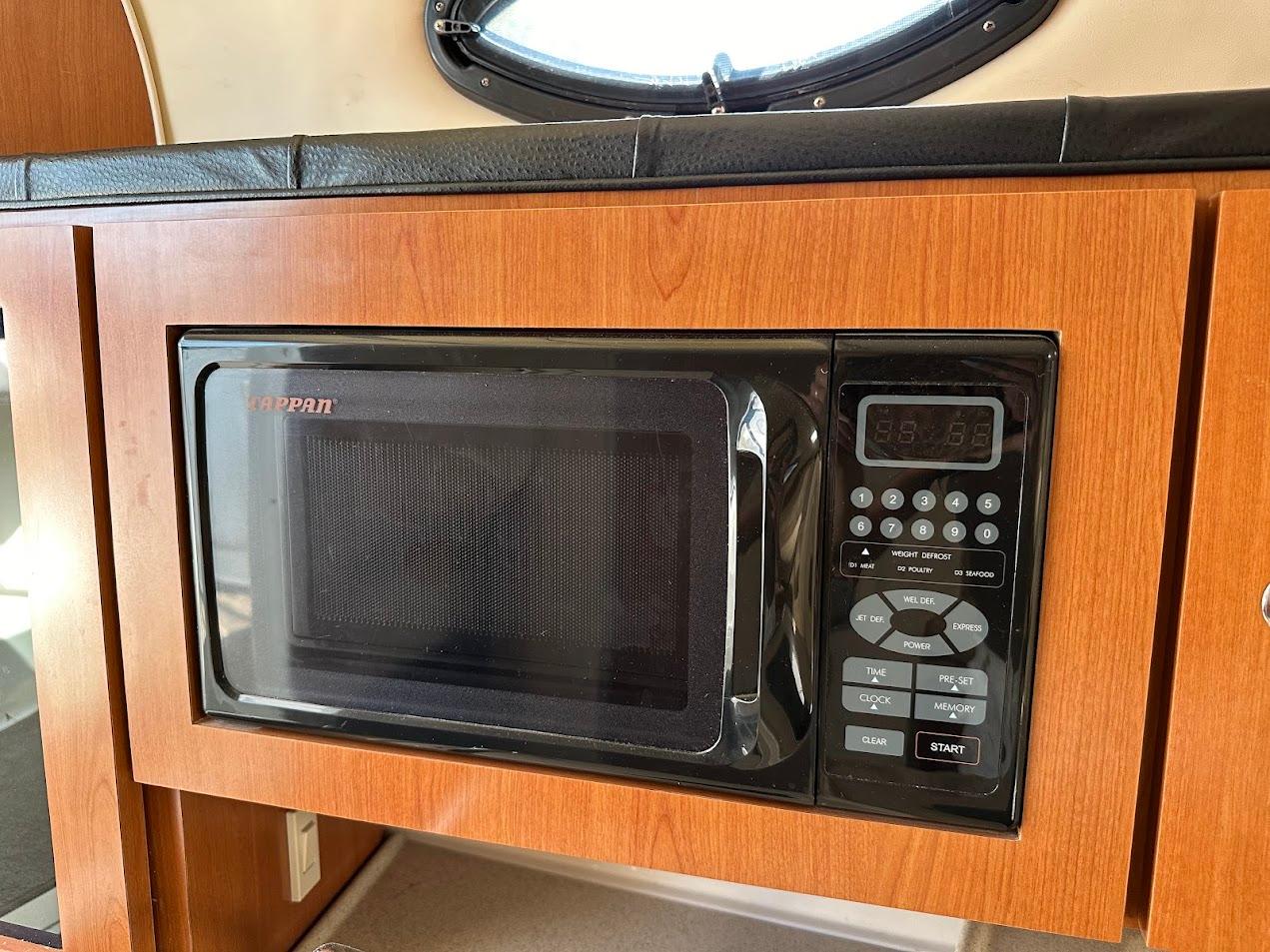 Built-in microwave in 2006 Wellcraft 290 Coastal boat kitchen area.