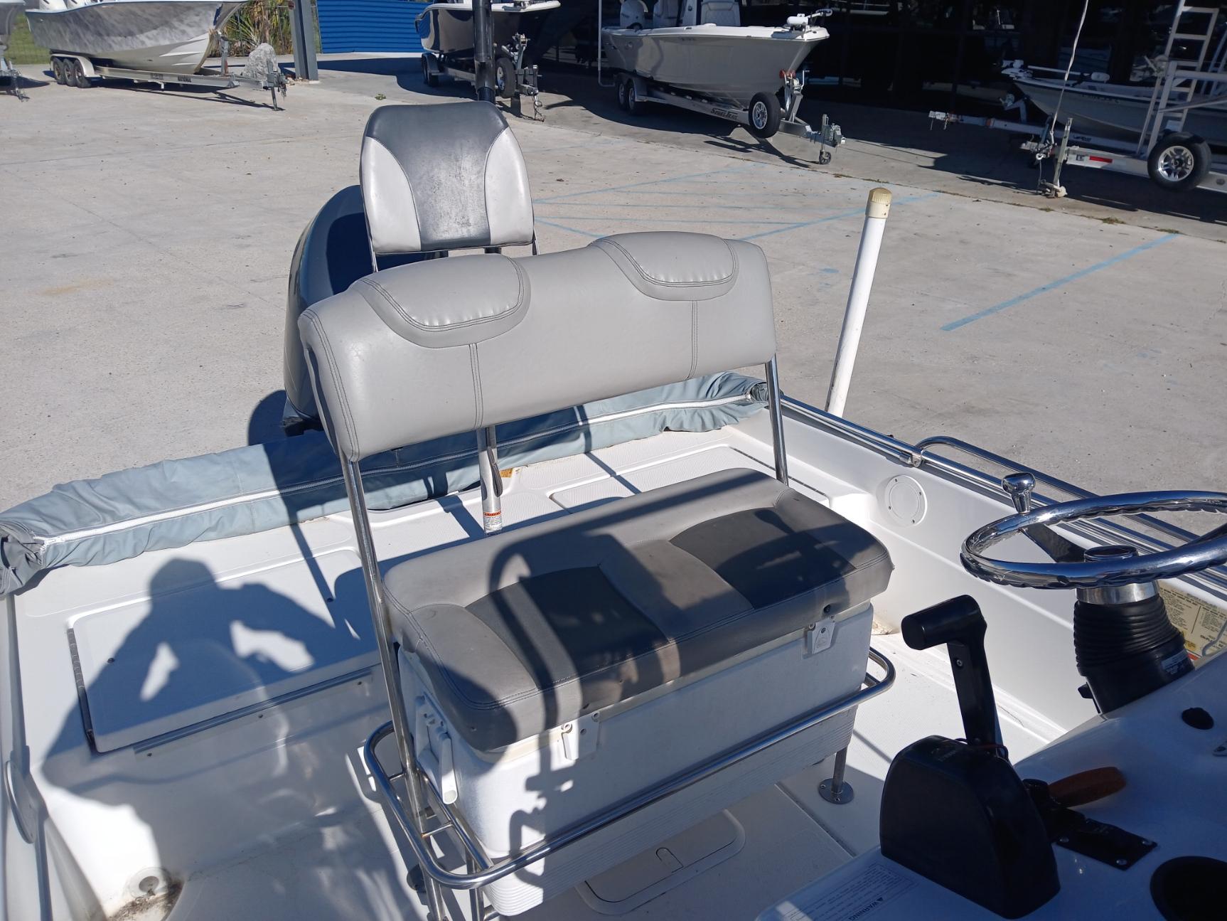 2008 Skeeter 20 ZX boat interior with seating and steering wheel in a marina setting.